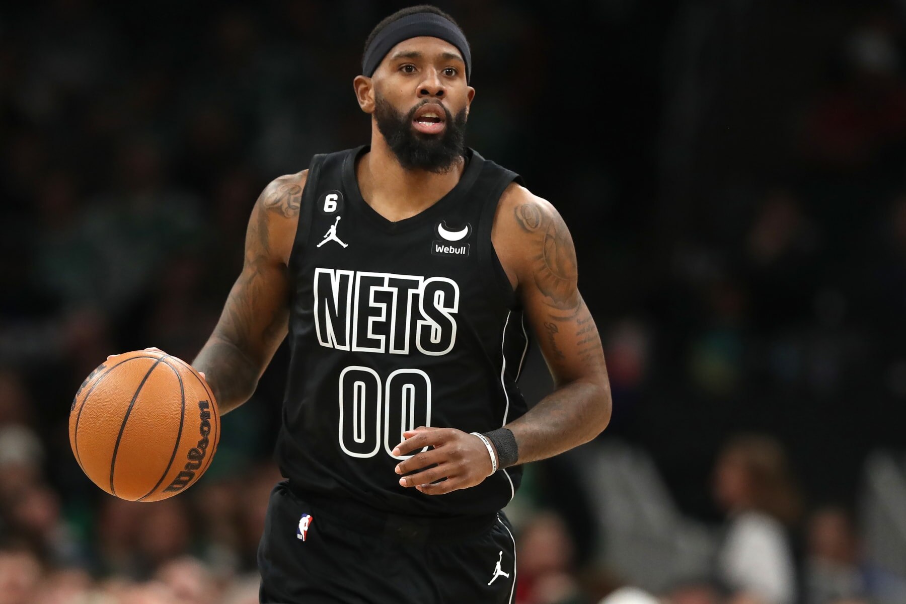 BOSTON, MASSACHUSETTS - FEBRUARY 01: Royce O'Neale #00 of the Brooklyn Nets dribbles against the Boston Celtics  during the first half at TD Garden on February 01, 2023 in Boston, Massachusetts. NOTE TO USER: User expressly acknowledges and agrees that, by downloading and or using this photograph, User is consenting to the terms and conditions of the Getty Images License Agreement. (Photo by Maddie Meyer/Getty Images)