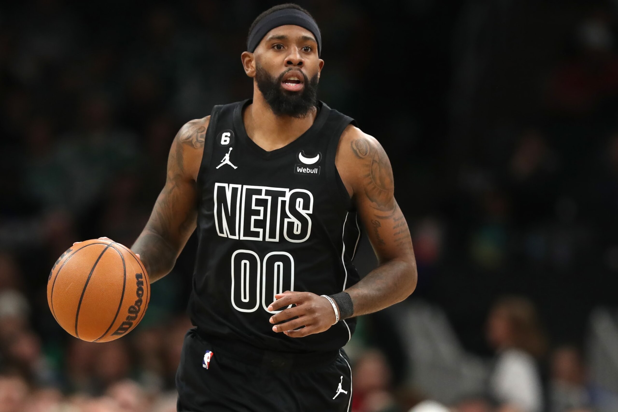 BOSTON, MASSACHUSETTS - FEBRUARY 01: Royce O'Neale #00 of the Brooklyn Nets dribbles against the Boston Celtics  during the first half at TD Garden on February 01, 2023 in Boston, Massachusetts. NOTE TO USER: User expressly acknowledges and agrees that, by downloading and or using this photograph, User is consenting to the terms and conditions of the Getty Images License Agreement. (Photo by Maddie Meyer/Getty Images)