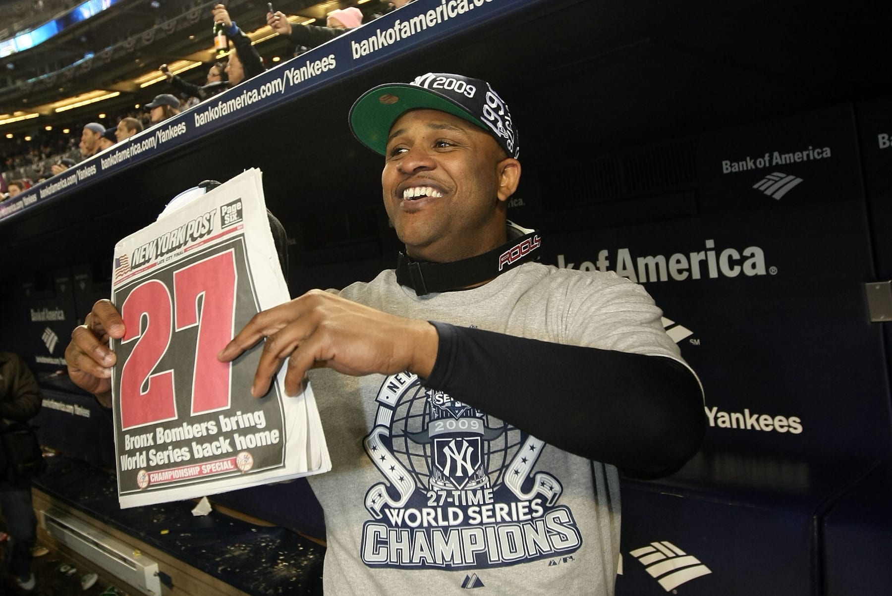 NEW YORK - NOVEMBER 04:  C.C. Sabathia of the New York Yankees celebrates in the dugout with a copy of the New York Post after their 7-3 win against the Philadelphia Phillies in Game Six of the 2009 MLB World Series at Yankee Stadium on November 4, 2009 in the Bronx borough of New York City.  (Photo by Nick Laham/Getty Images)