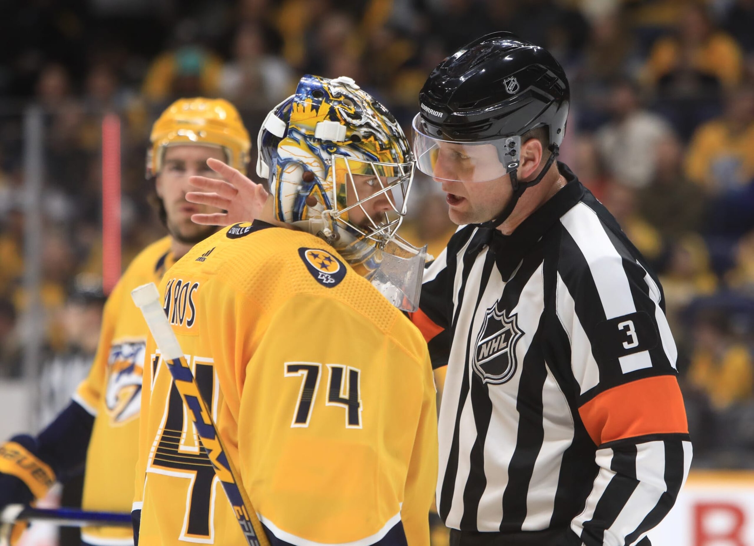 NASHVILLE, TN - FEBRUARY 07: Nashville Predators goalie Juuse Saros (74), of Finland, talks with referee Chris Schlenker (3) during the NHL game between the Nashville Predators and Vegas Golden Knights, held on February 7, 2023, at Bridgestone Arena in Nashville, Tennessee. (Photo by Danny Murphy/Icon Sportswire via Getty Images)