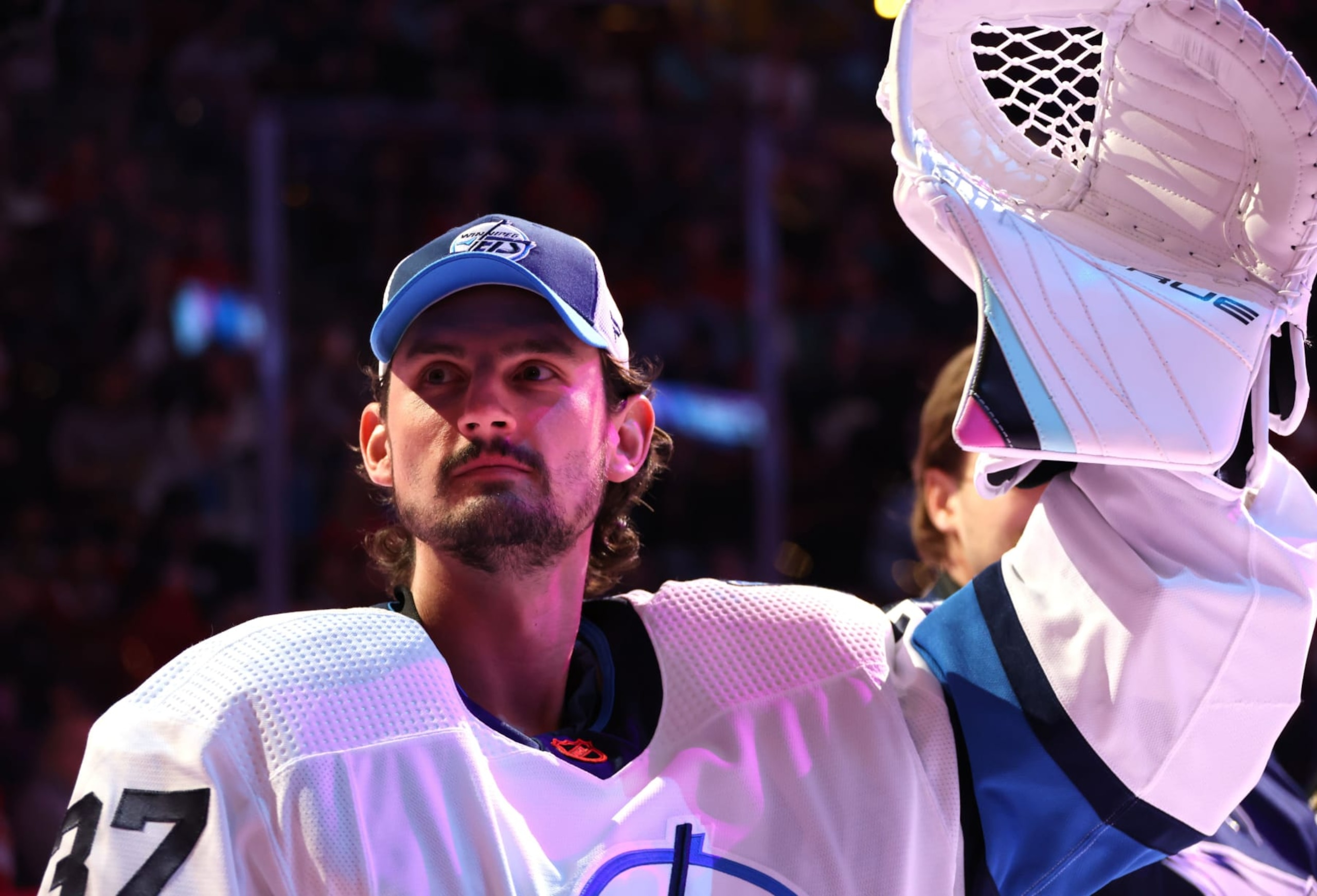 SUNRISE, FLORIDA - FEBRUARY 03: Connor Hellebuyck #37 of the Winnipeg Jets raises his glove to the fans during the Discover NHL Tendy Tandem event during the 2023 NHL All-Star Skills Competition at FLA Live Arena on February 03, 2023 in Sunrise, Florida. (Photo by Dave Sandford/NHLI via Getty Images)