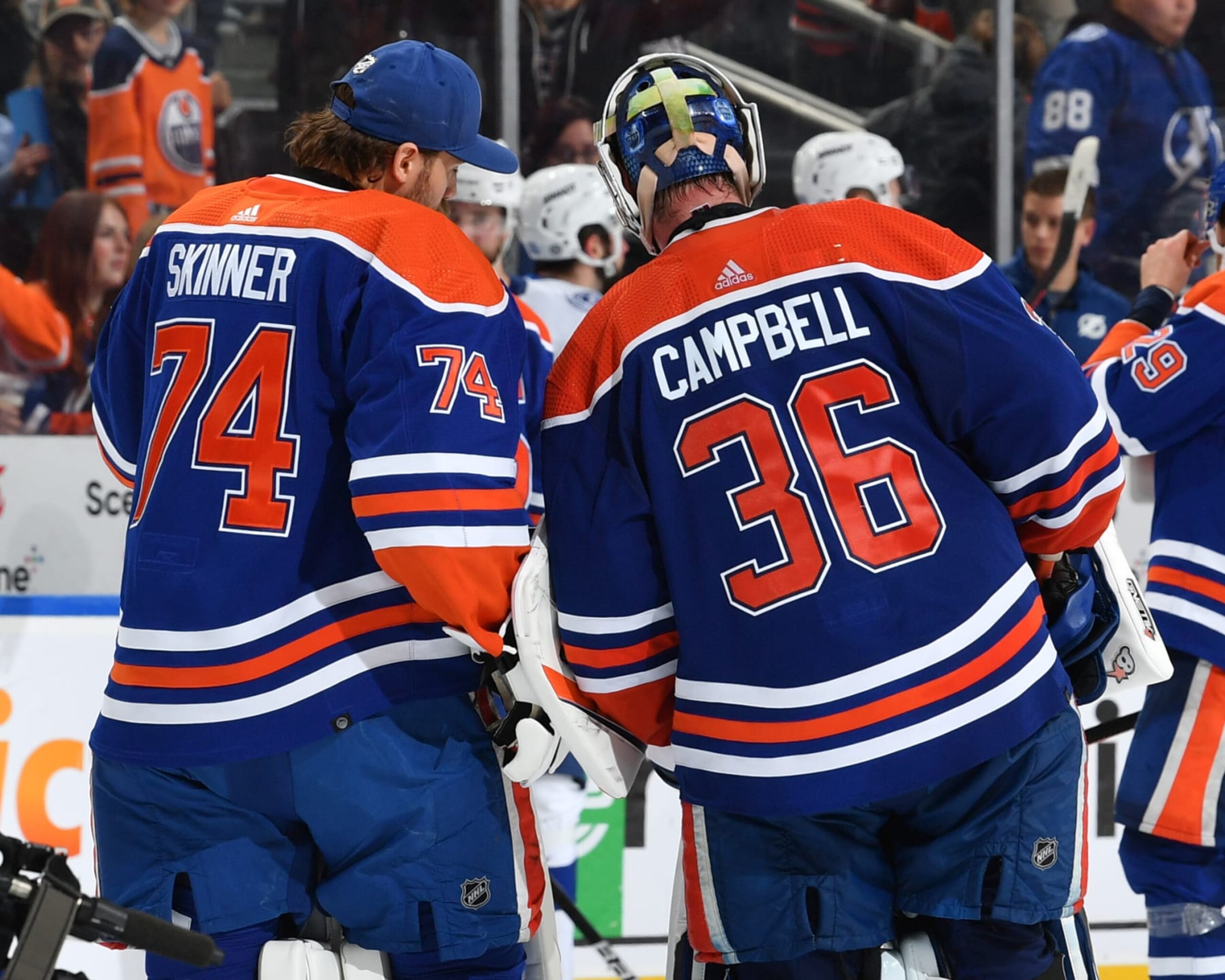 EDMONTON, CANADA - JANUARY 19: Jack Campbell #36 and Stuart Skinner #74 of the Edmonton Oilers have a conversation after their win over the Tampa Bay Lightning on January 19, 2023 at Rogers Place in Edmonton, Alberta, Canada. (Photo by Andy Devlin/NHLI via Getty Images)
