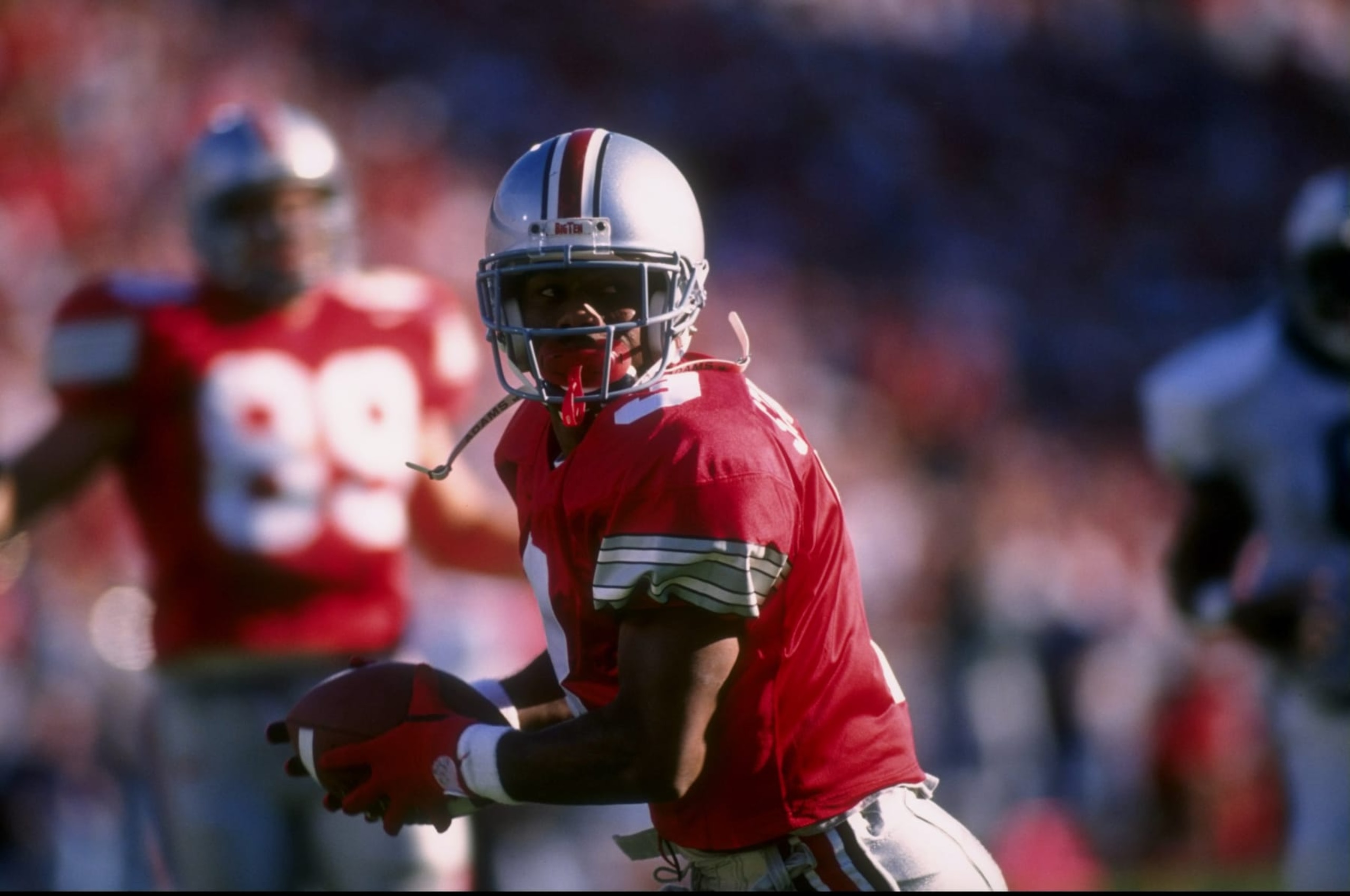 5 Oct 1996: Wide receiver Dimitrious Stanley of Ohio State University carries the football after making a catch during the Buckeyes 38-7 win over Penn State at Ohio Stadium in Columbus, Ohio. 5 Oct 1996: Wide receiver Dimitrious Stanley of Ohio State University carries the football after making a catch during the Buckeyes 38-7 win over Penn State at Ohio Stadium in Columbus, Ohio.