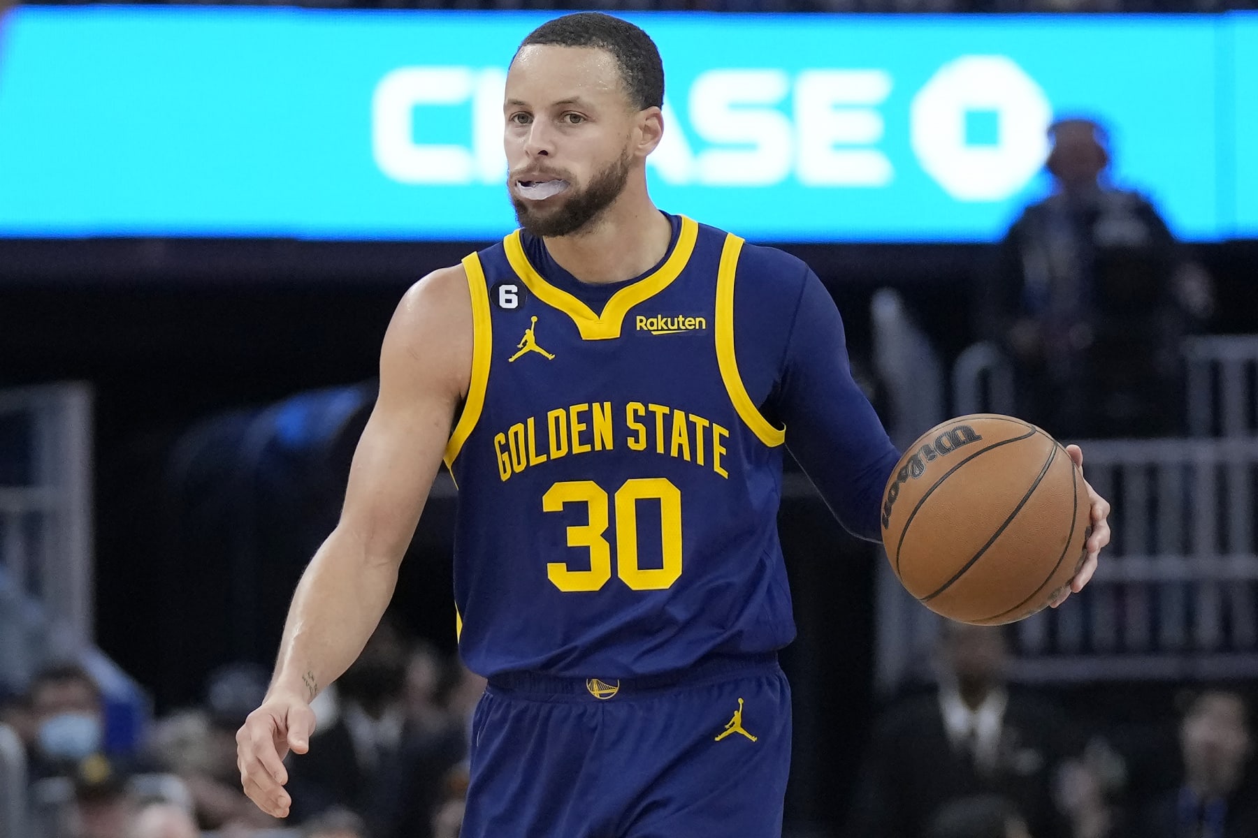 Golden State Warriors guard Stephen Curry (30) brings the ball up the court against the Dallas Mavericks during the second half of an NBA basketball game in San Francisco, Saturday, Feb. 4, 2023. (AP Photo/Jeff Chiu)