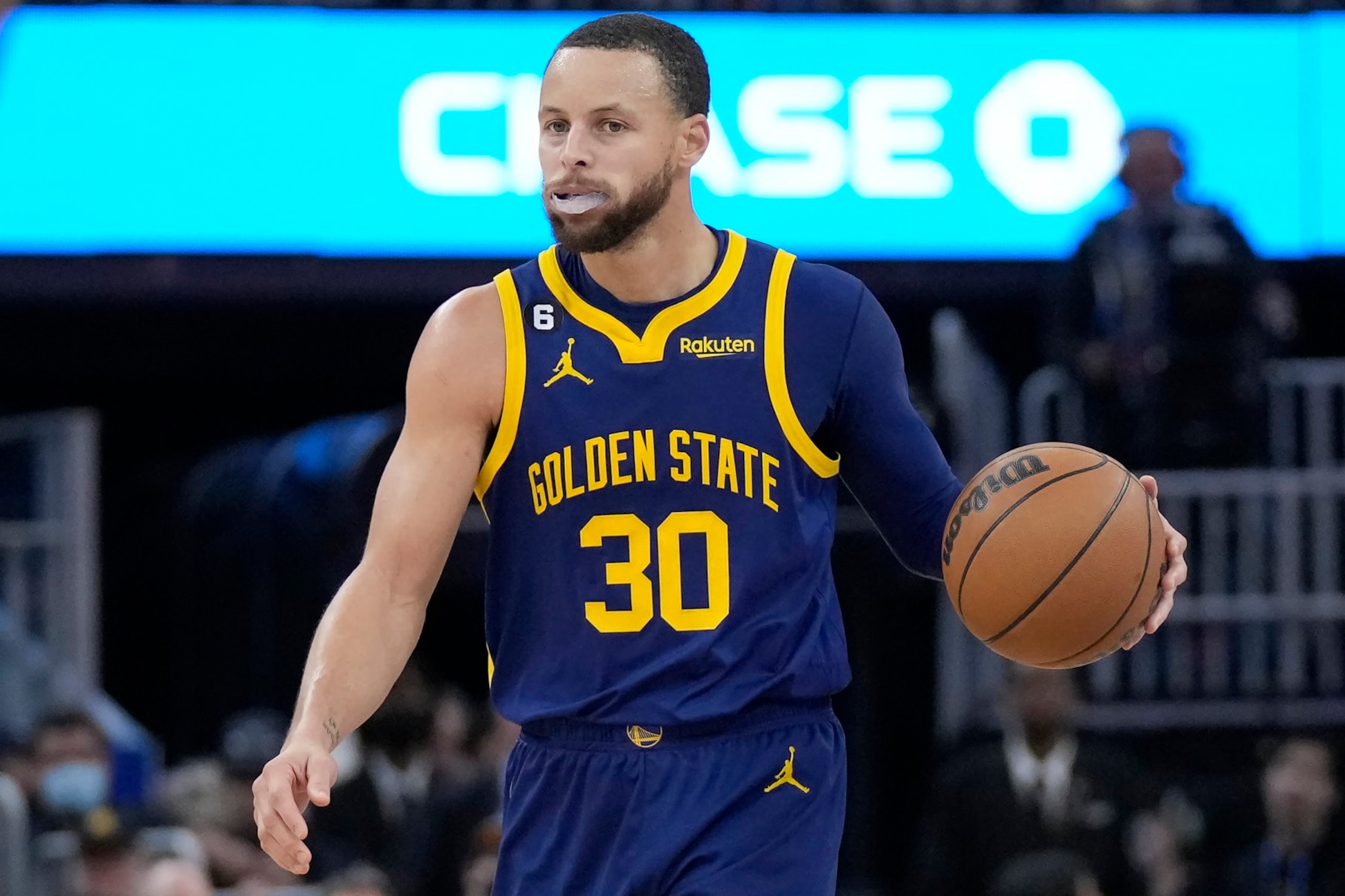 Golden State Warriors guard Stephen Curry (30) brings the ball up the court against the Dallas Mavericks during the second half of an NBA basketball game in San Francisco, Saturday, Feb. 4, 2023. (AP Photo/Jeff Chiu)