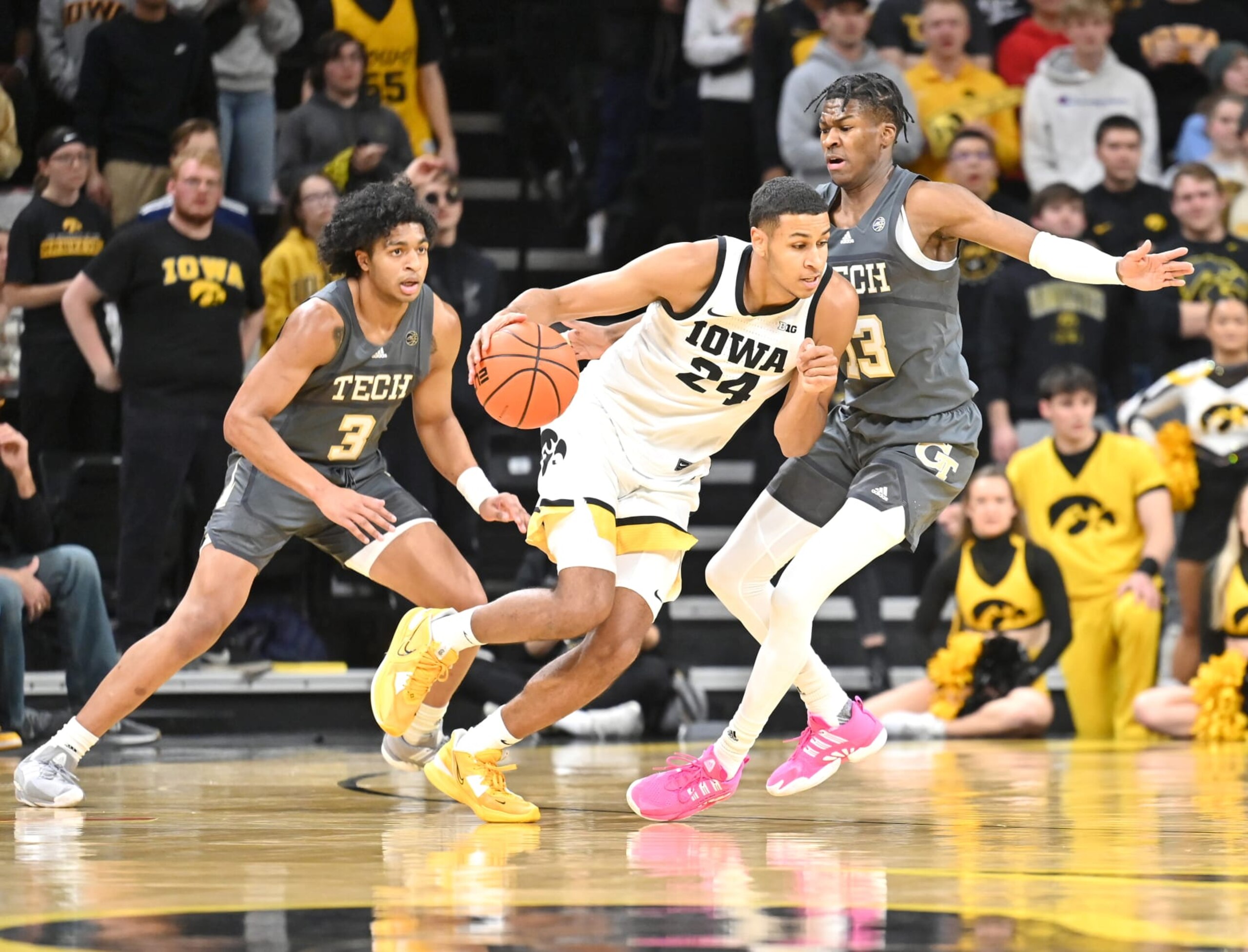 IOWA CITY, IA - NOVEMBER 29: Iowa forward Kris Murray (24) drives to the basket as Georgia Tech guard Miles Kelly (13) defends during a college basketball game between the Georgia Tech Yellow Jackets and the Iowa Hawkeyes on November 29, 2022, at Carver-Hawkeye Arena in Iowa City, IA. (Photo by Keith Gillett/Icon Sportswire via Getty Images)
