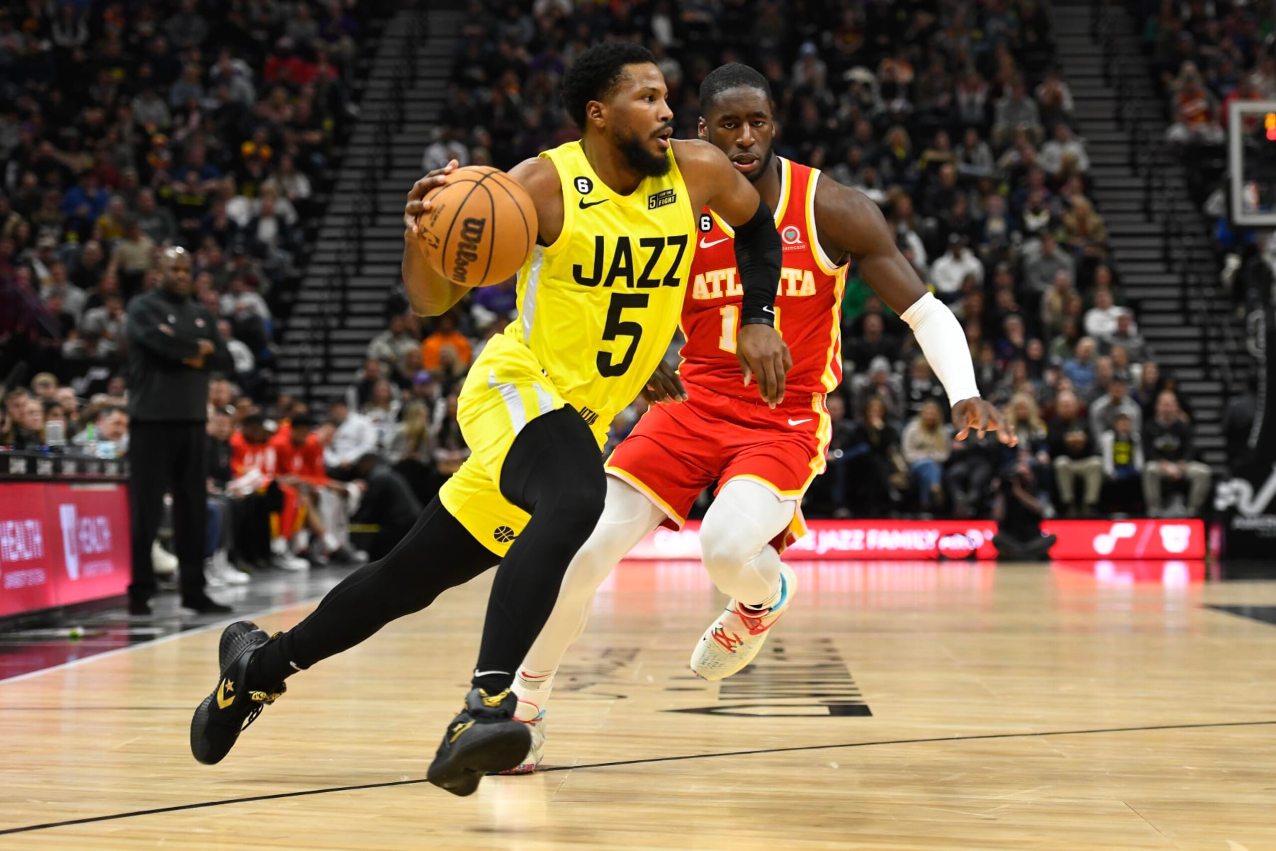 SALT LAKE CITY, UTAH - FEBRUARY 03: Malik Beasley #5 of the Utah Jazz drives past AJ Griffin #14 of the Atlanta Hawks during the first half of a game at Vivint Arena on February 03, 2023 in Salt Lake City, Utah.  NOTE TO USER: User expressly acknowledges and agrees that, by downloading and or using this photograph, User is consenting to the terms and conditions of the Getty Images License Agreement. (Photo by Alex Goodlett/Getty Images)