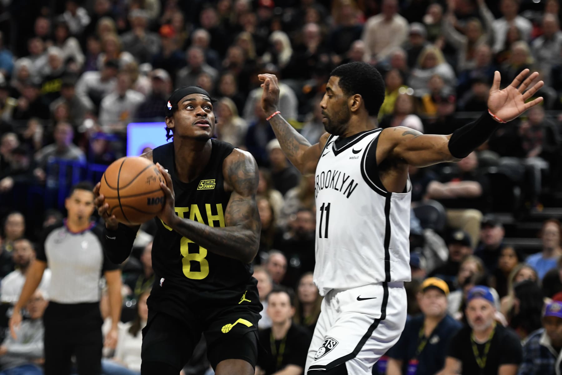 SALT LAKE CITY, UTAH - JANUARY 20: Kyrie Irving #11 of the Brooklyn Nets defends Jarred Vanderbilt #8 of the Utah Jazz during the second half of a game at Vivint Arena on January 20, 2023 in Salt Lake City, Utah. NOTE TO USER: User expressly acknowledges and agrees that, by downloading and or using this photograph, User is consenting to the terms and conditions of the Getty Images License Agreement. (Photo by Alex Goodlett/Getty Images)