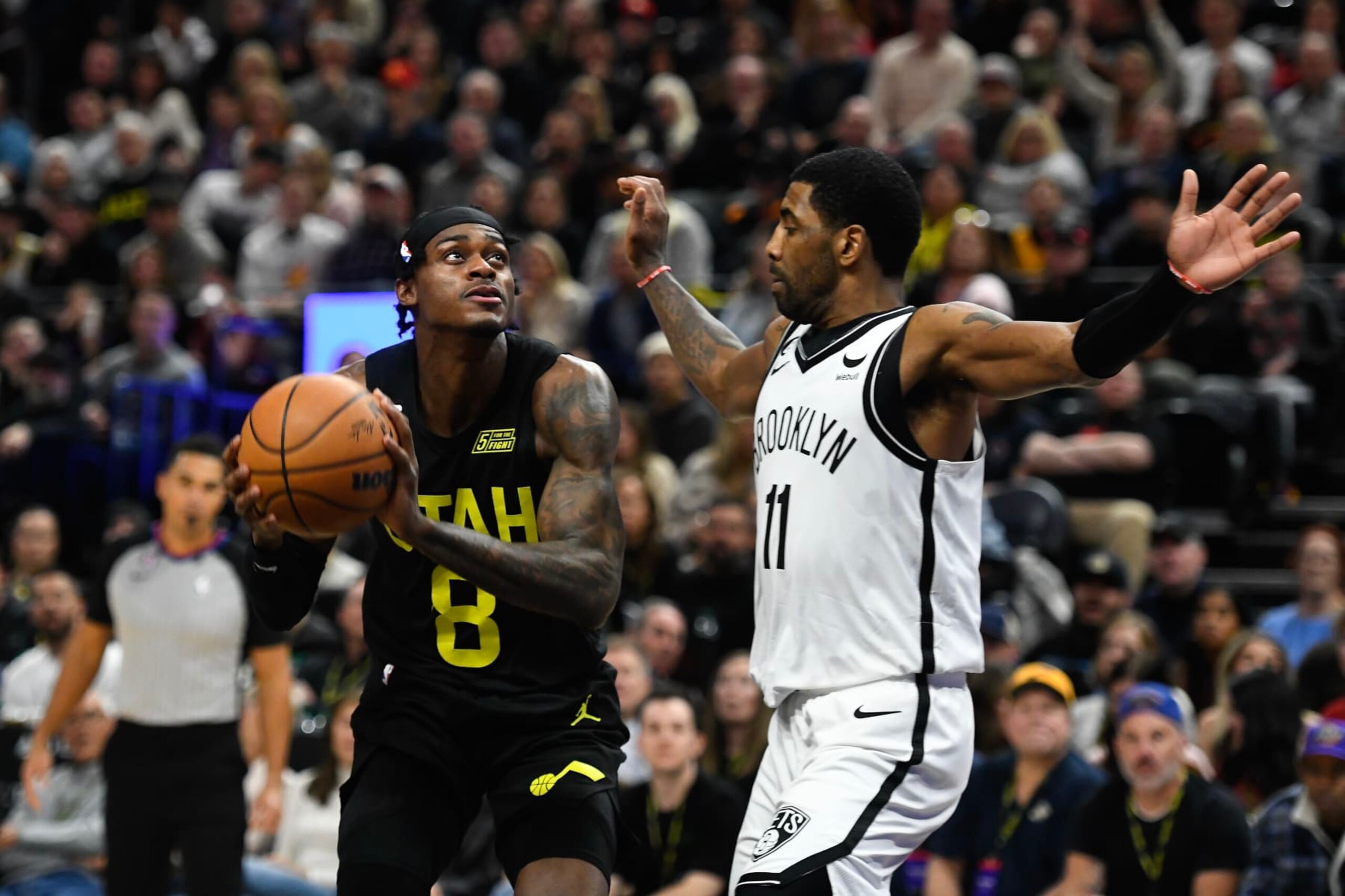 SALT LAKE CITY, UTAH - JANUARY 20: Kyrie Irving #11 of the Brooklyn Nets defends Jarred Vanderbilt #8 of the Utah Jazz during the second half of a game at Vivint Arena on January 20, 2023 in Salt Lake City, Utah. NOTE TO USER: User expressly acknowledges and agrees that, by downloading and or using this photograph, User is consenting to the terms and conditions of the Getty Images License Agreement. (Photo by Alex Goodlett/Getty Images)
