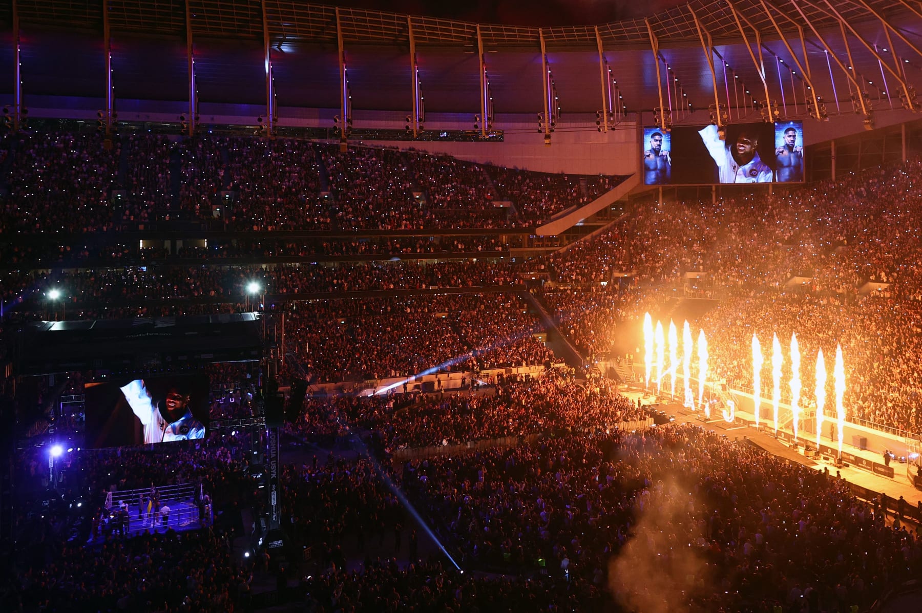 The crowd cheers as Britain's Anthony Joshua arrives for his heavyweight title bout against Ukraine's Oleksandr Usyk at Tottenham Hotspur Stadium in north London on September 25, 2021. (Photo by Adrian DENNIS / AFP) (Photo by ADRIAN DENNIS/AFP via Getty Images)