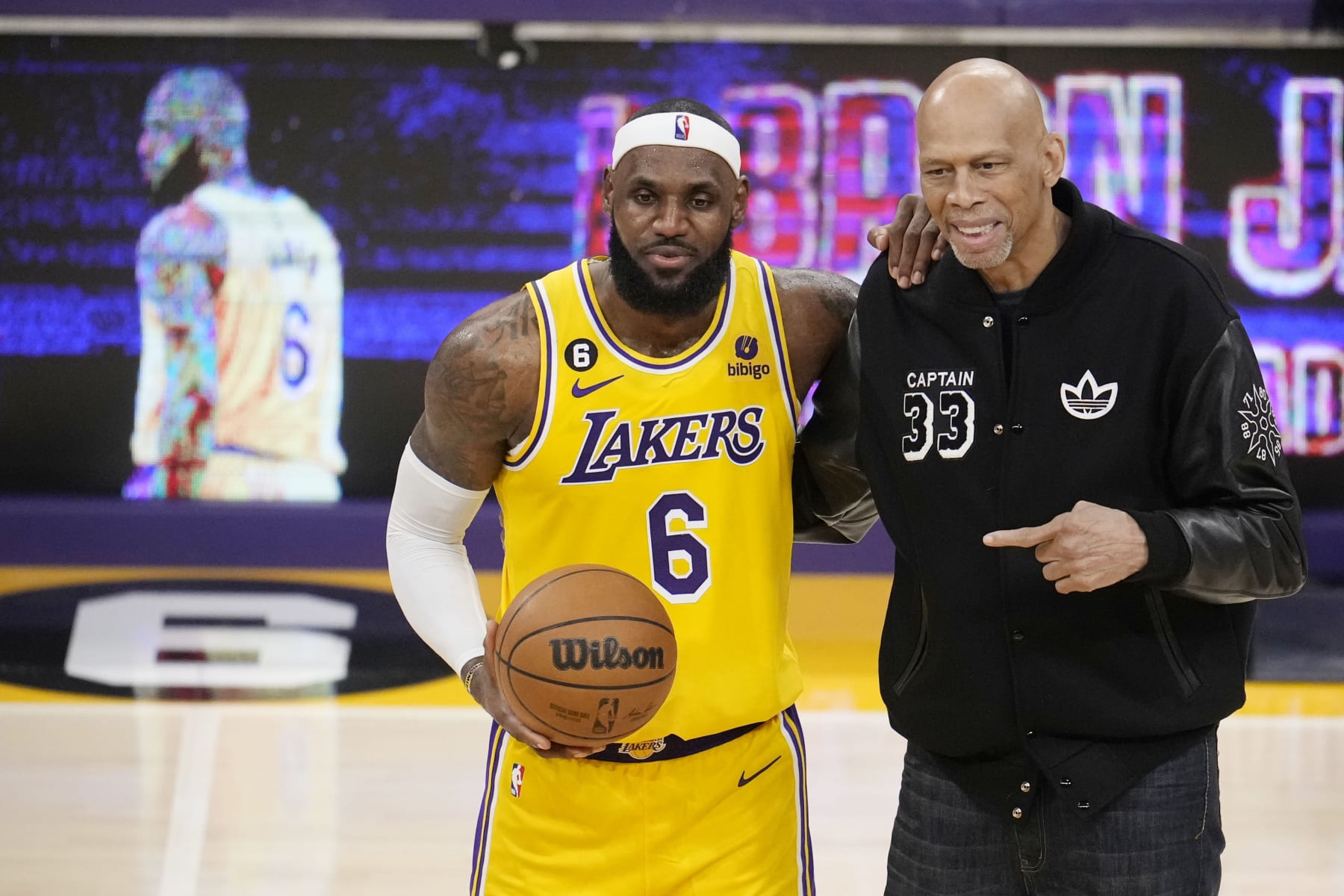 Los Angeles Lakers forward LeBron James, left, poses for a photo with Kareem Abdul-Jabbar after James become the NBA's all-time leading scorer during the second half of an NBA basketball game against the Oklahoma City Thunder Tuesday, Feb. 7, 2023, in Los Angeles. (AP Photo/Marcio Jose Sanchez)