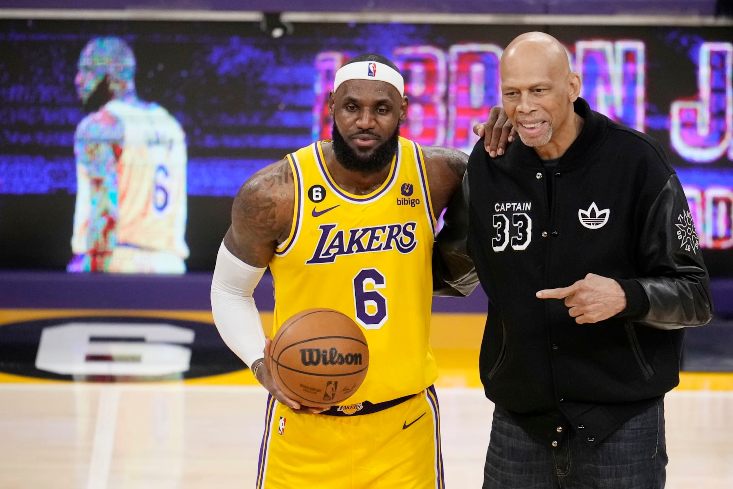Los Angeles Lakers forward LeBron James, left, poses for a photo with Kareem Abdul-Jabbar after James become the NBA's all-time leading scorer during the second half of an NBA basketball game against the Oklahoma City Thunder Tuesday, Feb. 7, 2023, in Los Angeles. (AP Photo/Marcio Jose Sanchez)