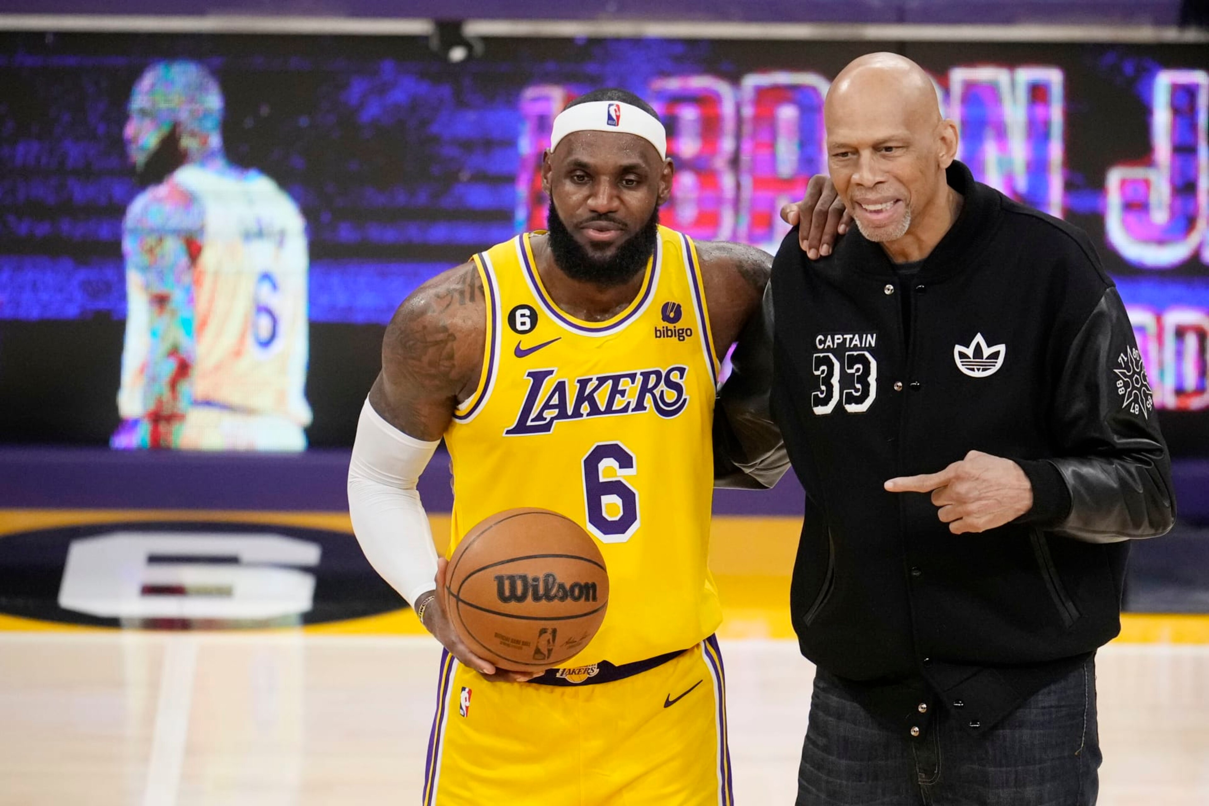 Los Angeles Lakers forward LeBron James, left, poses for a photo with Kareem Abdul-Jabbar after James become the NBA's all-time leading scorer during the second half of an NBA basketball game against the Oklahoma City Thunder Tuesday, Feb. 7, 2023, in Los Angeles. (AP Photo/Marcio Jose Sanchez)