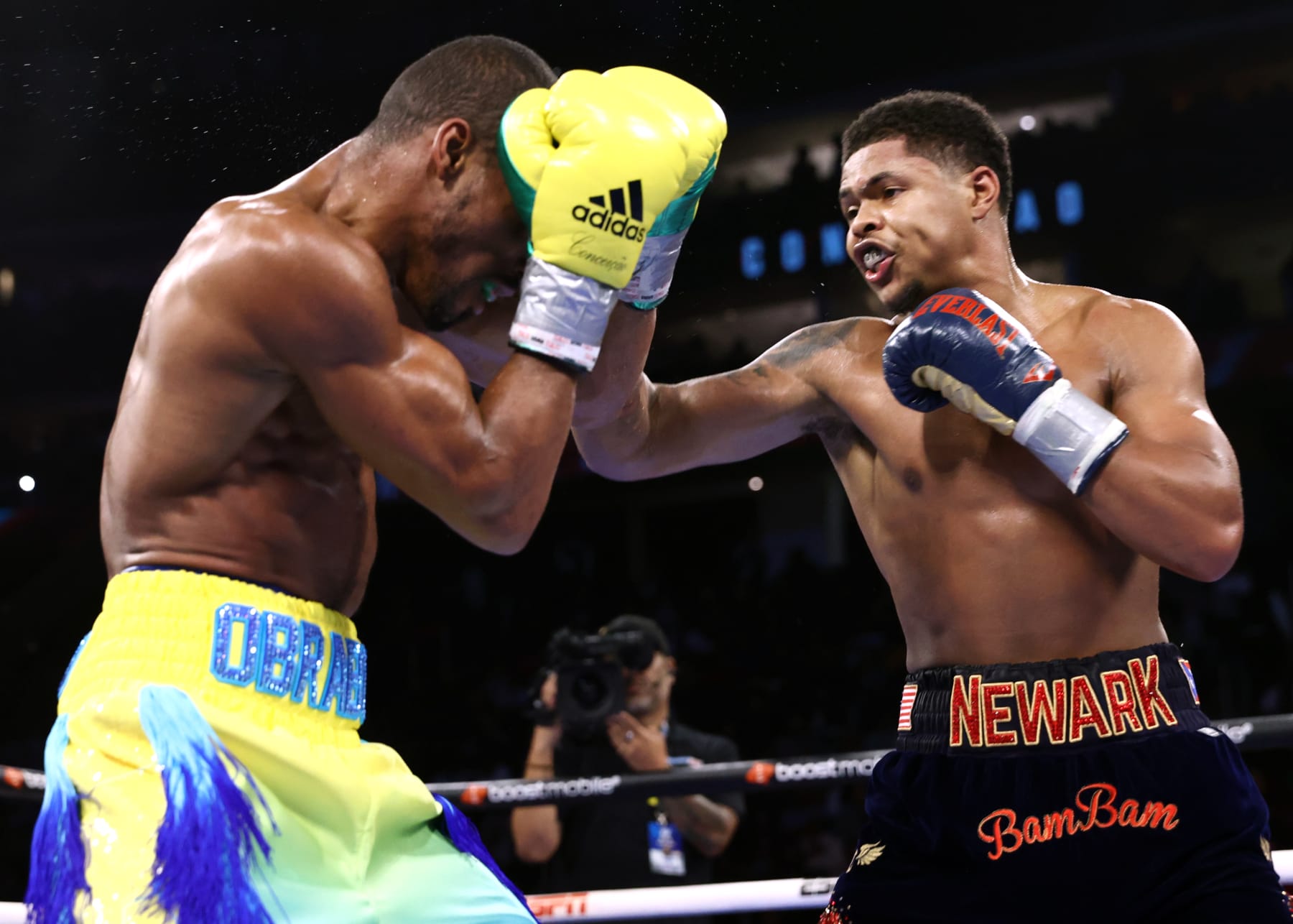 NEWARK, NEW JERSEY - SEPTEMBER 23: Robson Conceição (L) and Shakur Stevenson (R) exchange punches during their WBC and WBO junior lightweight championship fight at Prudential Center on September 23, 2023 in Newark, New Jersey. (Photo by Mikey Williams/Top Rank Inc via Getty Images)