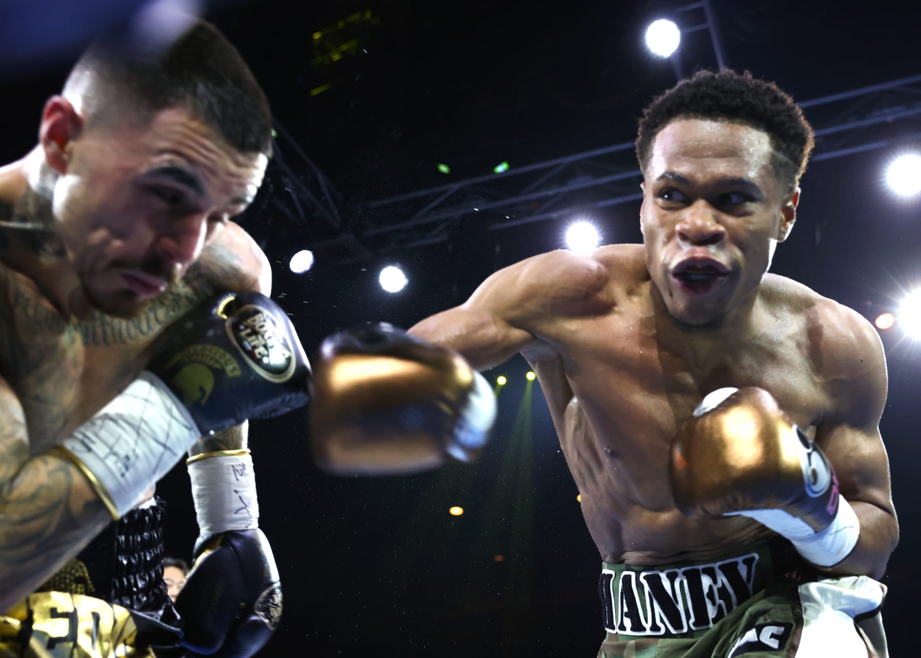MELBOURNE, AUSTRALIA - OCTOBER 16: George Kambosos Jnr (L) and Devin Haney (R) exchange punches during their World Lightweight Undisputed Championship fight, at Rod Laver Arena on October 16, 2022 in Melbourne, Australia. (Photo by Mikey Williams/Top Rank Inc via Getty Images)