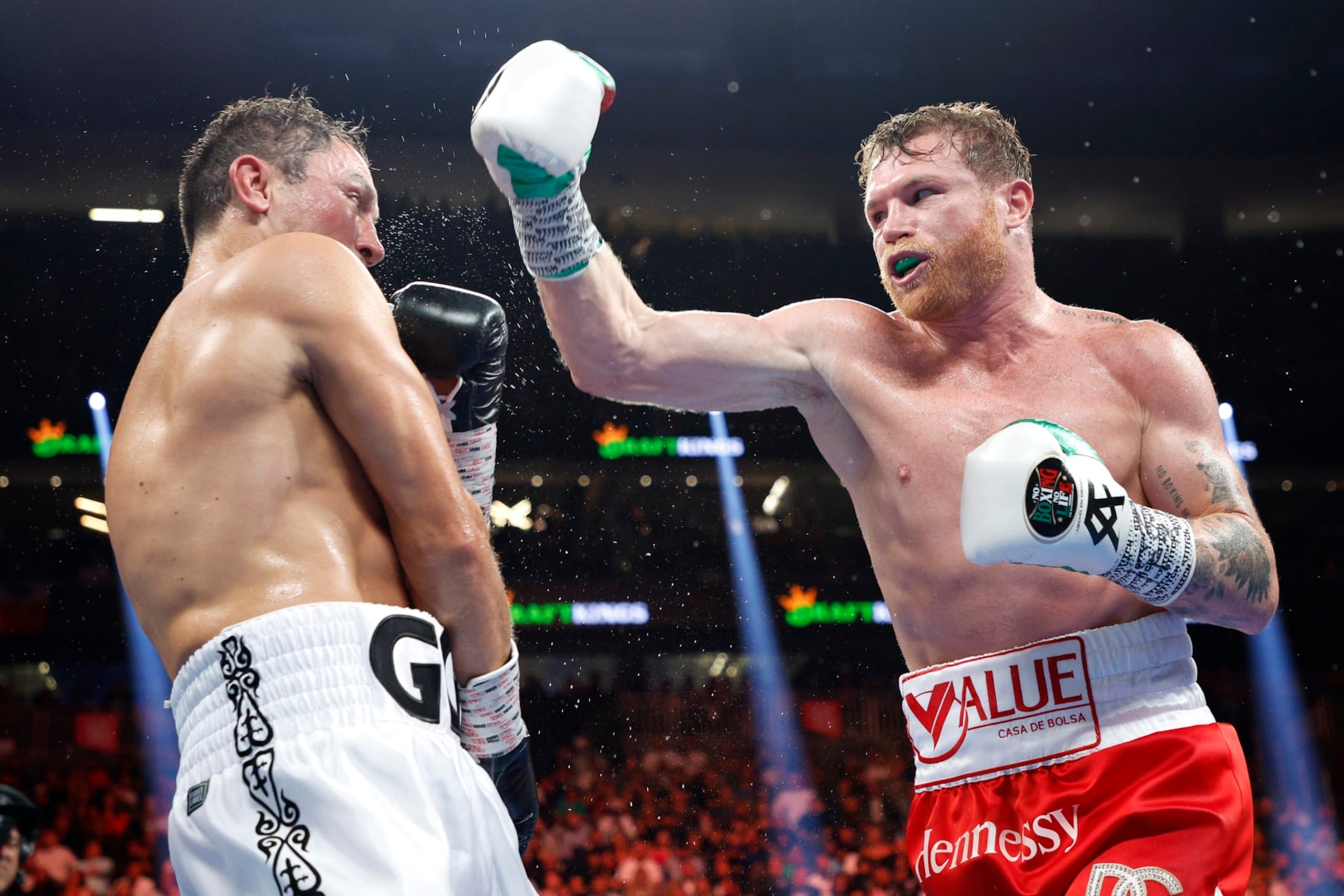 LAS VEGAS, NEVADA - SEPTEMBER 17: Canelo Alvarez (red trunks) and Gennadiy Golovkin (white trunks) exchange punches in the fight for the Super Middleweight Title at T-Mobile Arena on September 17, 2022 in Las Vegas, Nevada. (Photo by Sarah Stier/Getty Images)