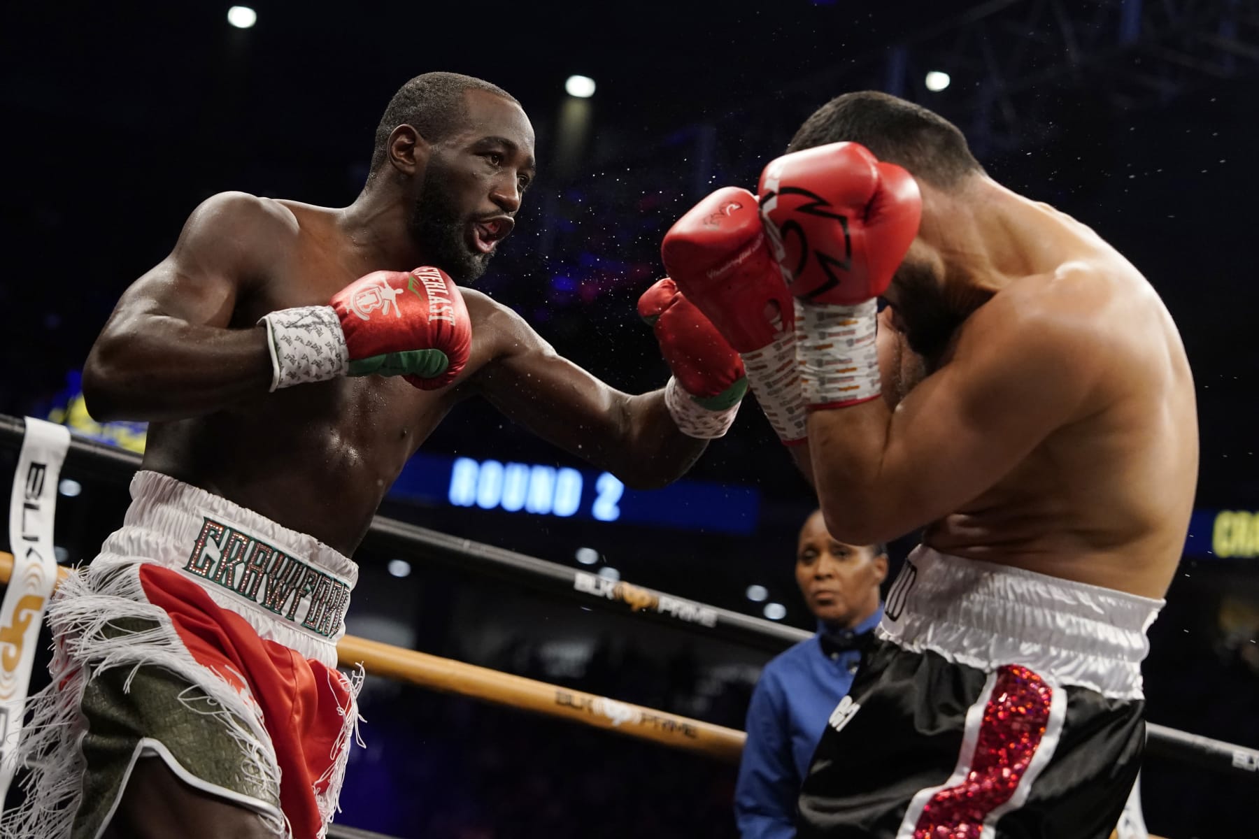 OMAHA, NEBRASKA - DECEMBER 10:  WBO champion Terence Crawford (L) punches David Avanesyan during their welterweight title fight at CHI Health Center on December 10, 2022 in Omaha, Nebraska. (Photo by Ed Zurga/Getty Images)
