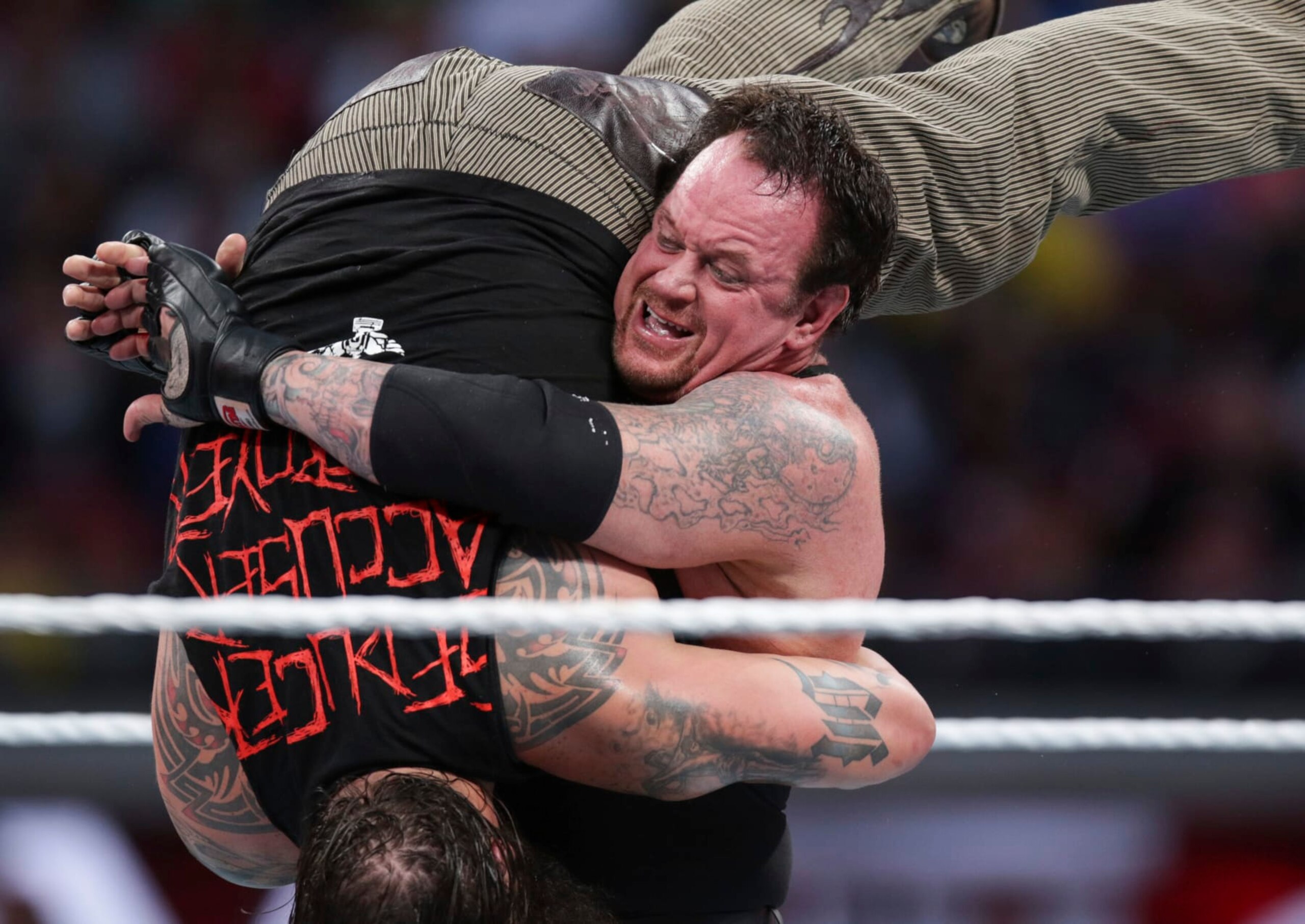FILE - In this March 29, 2015, file photo, Bray Wyatt is upended by his opponent, The Undertaker, at Wrestlemania XXXI in Santa Clara, Calif. The WWE is set for its annual sports entertainment extravaganza Sunday, April 1, 2017, in Orlando, Fla. John Cena, the Undertaker, the Miz and the Bella Twins all have big matches on the show. (AP Photo/Don Feria, File)
