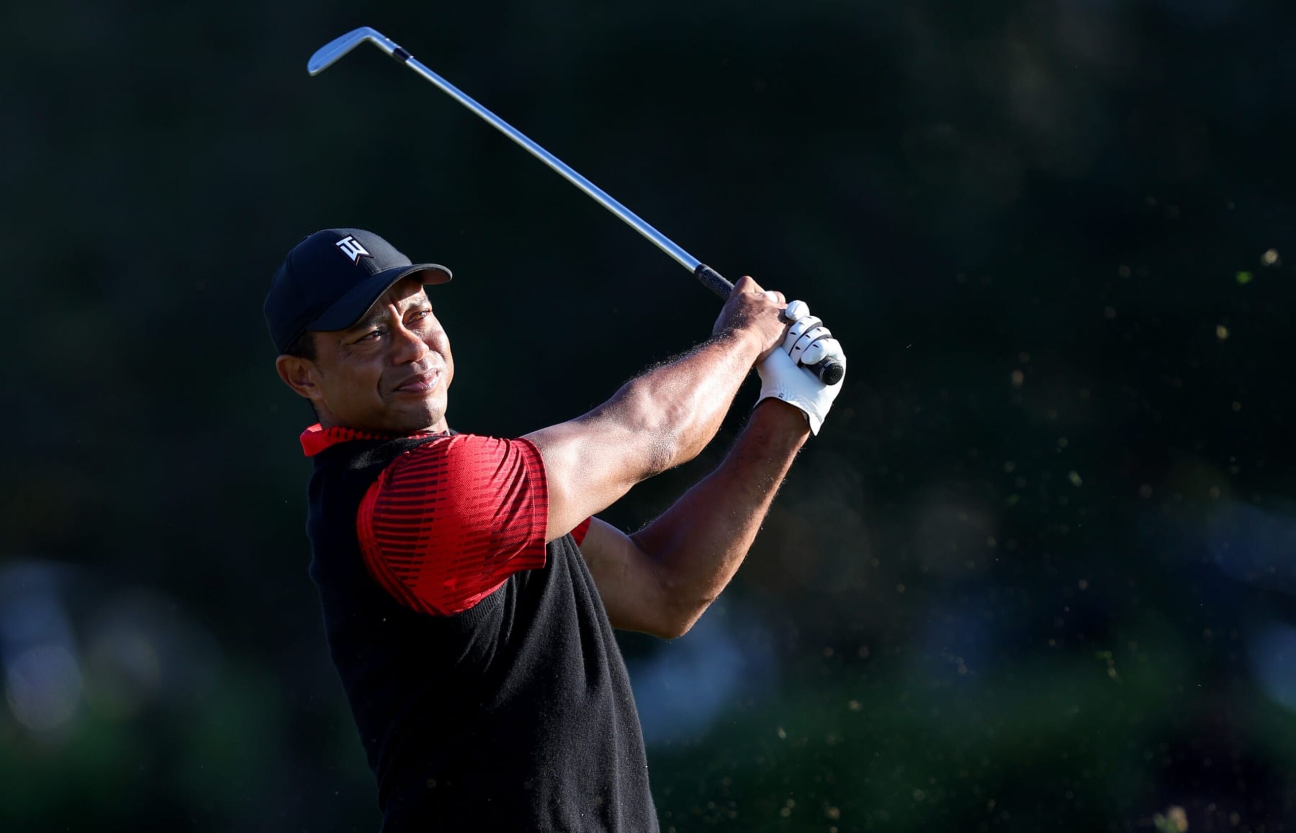 ORLANDO, FLORIDA - DECEMBER 18:  Tiger Woods plays his shot from the 17th tee  during the final round of the PNC Championship at Ritz-Carlton Golf Club on December 18, 2022 in Orlando, Florida. (Photo by Mike Ehrmann/Getty Images)