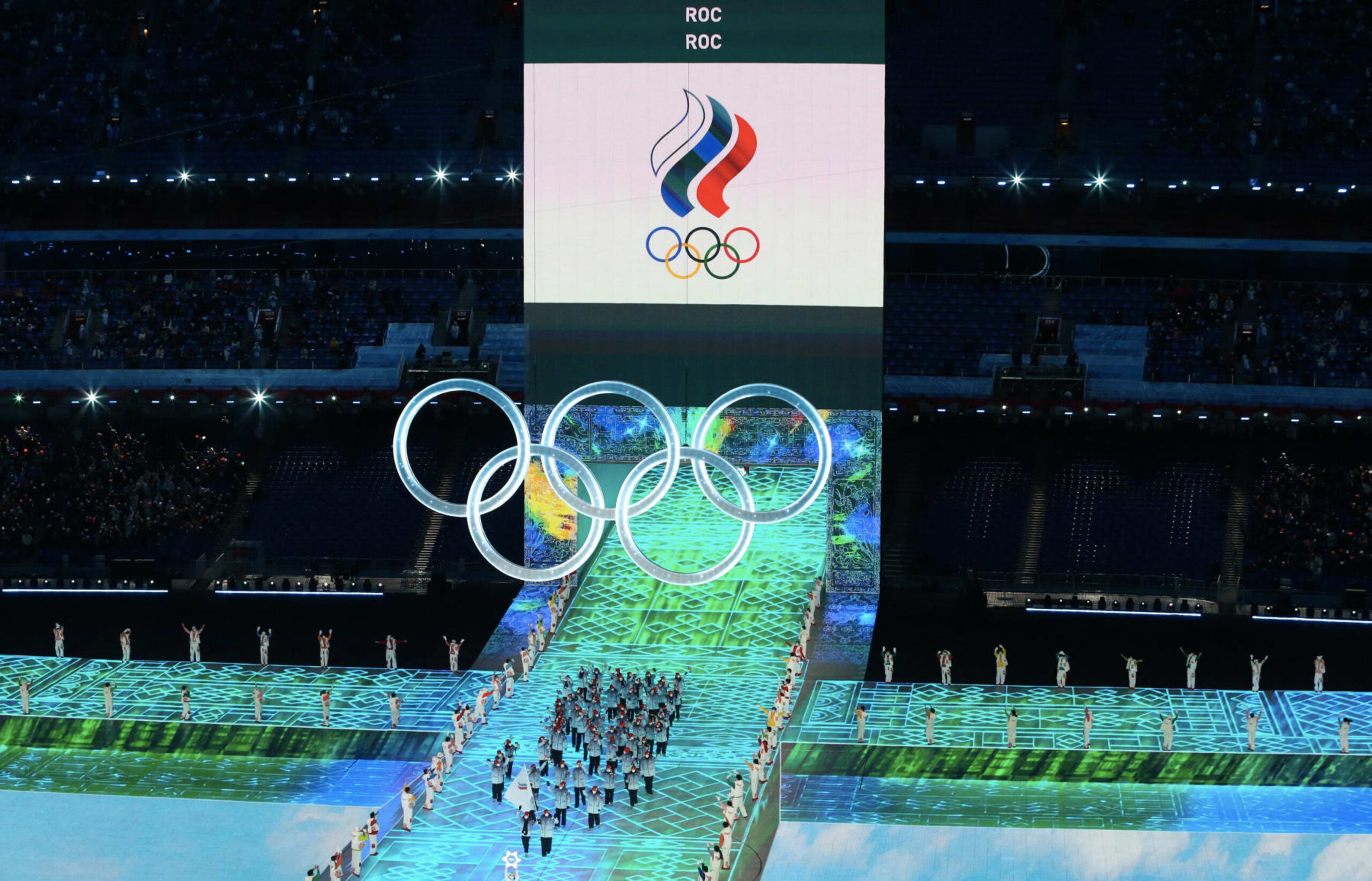 BEIJING, CHINA - FEBRUARY 04: Flag bearers Olga Fatkulina and Vadim Shipachyov of Team ROC carry their flag during the Opening Ceremony of the Beijing 2022 Winter Olympics at the Beijing National Stadium on February 04, 2022 in Beijing, China. (Photo by Xavier Laine/Getty Images)