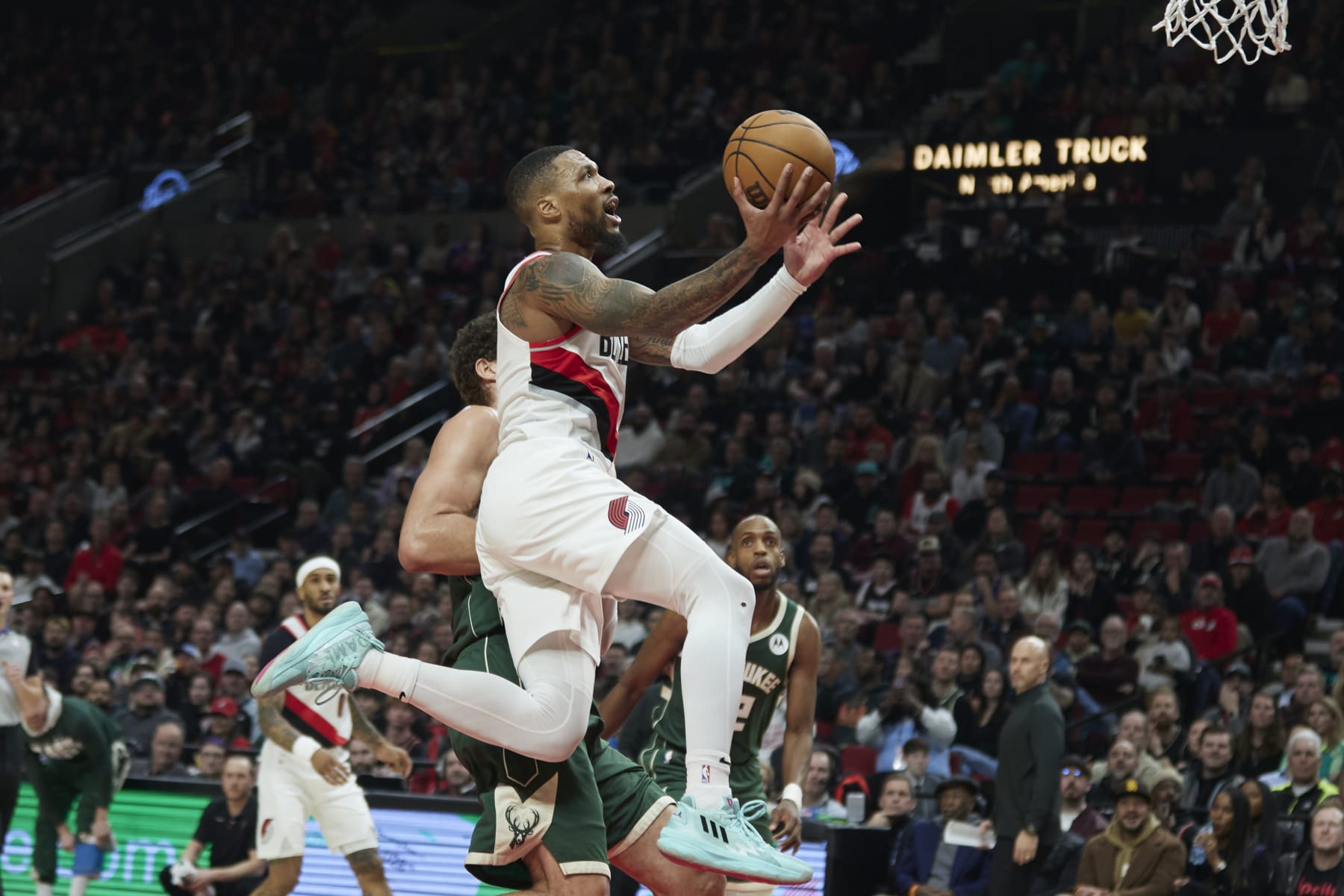 Portland Trail Blazers guard Damian Lillard shoots against the Milwaukee Bucks during the first half of an NBA basketball game in Portland, Ore., Monday, Feb. 6, 2023. (AP Photo/Craig Mitchelldyer)
