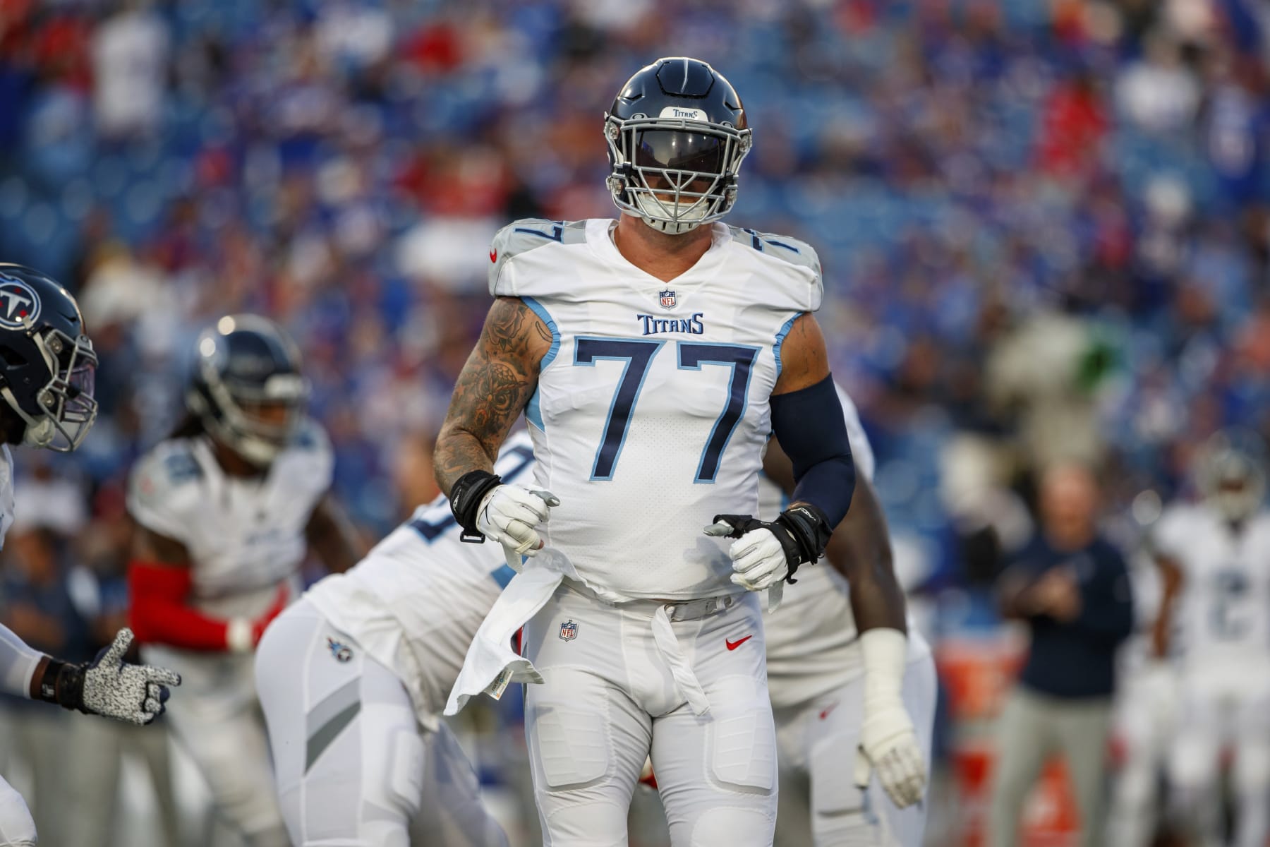Tennessee Titans offensive tackle Taylor Lewan (77) warms up before an NFL football game, Monday, Sept. 19, 2022, in Orchard Park, NY. (AP Photo/Matt Durisko)