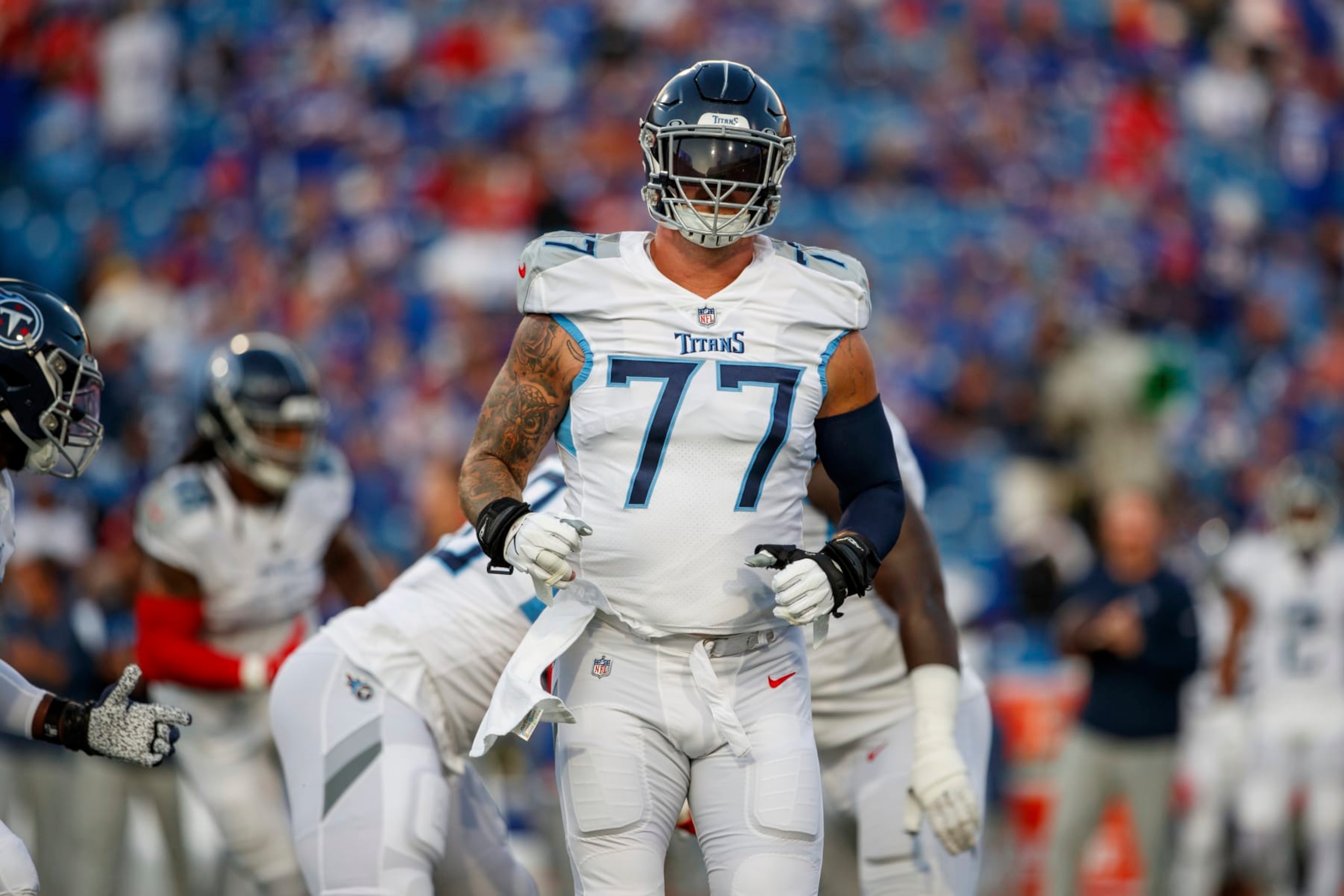 Tennessee Titans offensive tackle Taylor Lewan (77) warms up before an NFL football game, Monday, Sept. 19, 2022, in Orchard Park, NY. (AP Photo/Matt Durisko)