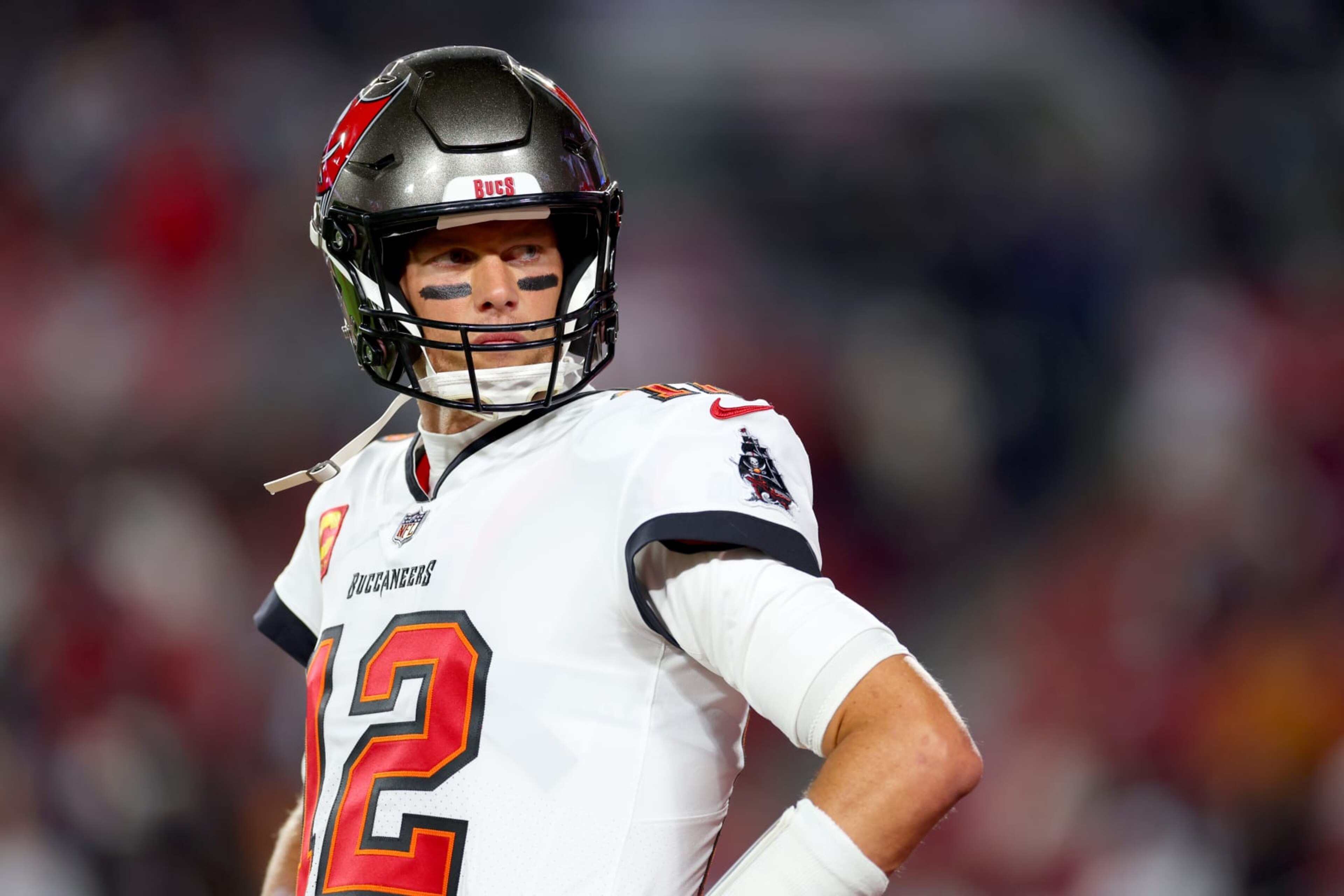 TAMPA, FLORIDA - JANUARY 16: Tom Brady #12 of the Tampa Bay Buccaneers warms up prior to a game against the Dallas Cowboys in the NFC Wild Card playoff game at Raymond James Stadium on January 16, 2023 in Tampa, Florida. (Photo by Mike Ehrmann/Getty Images) TAMPA, FLORIDA - JANUARY 16: Tom Brady #12 of the Tampa Bay Buccaneers warms up prior to a game against the Dallas Cowboys in the NFC Wild Card playoff game at Raymond James Stadium on January 16, 2023 in Tampa, Florida. (Photo by Mike Ehrmann/Getty Images)