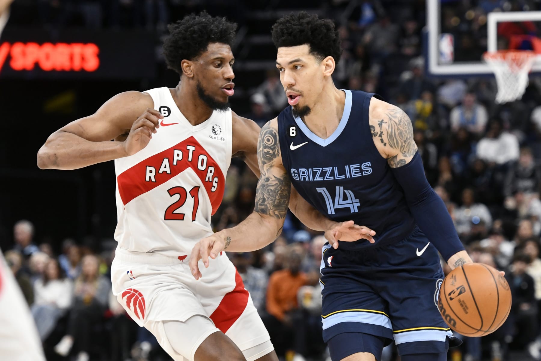 Memphis Grizzlies guard Danny Green (14) handles the ball against Toronto Raptors forward Thaddeus Young (21) in the second half of an NBA basketball game Sunday, Feb. 5, 2023, in Memphis, Tenn. (AP Photo/Brandon Dill)