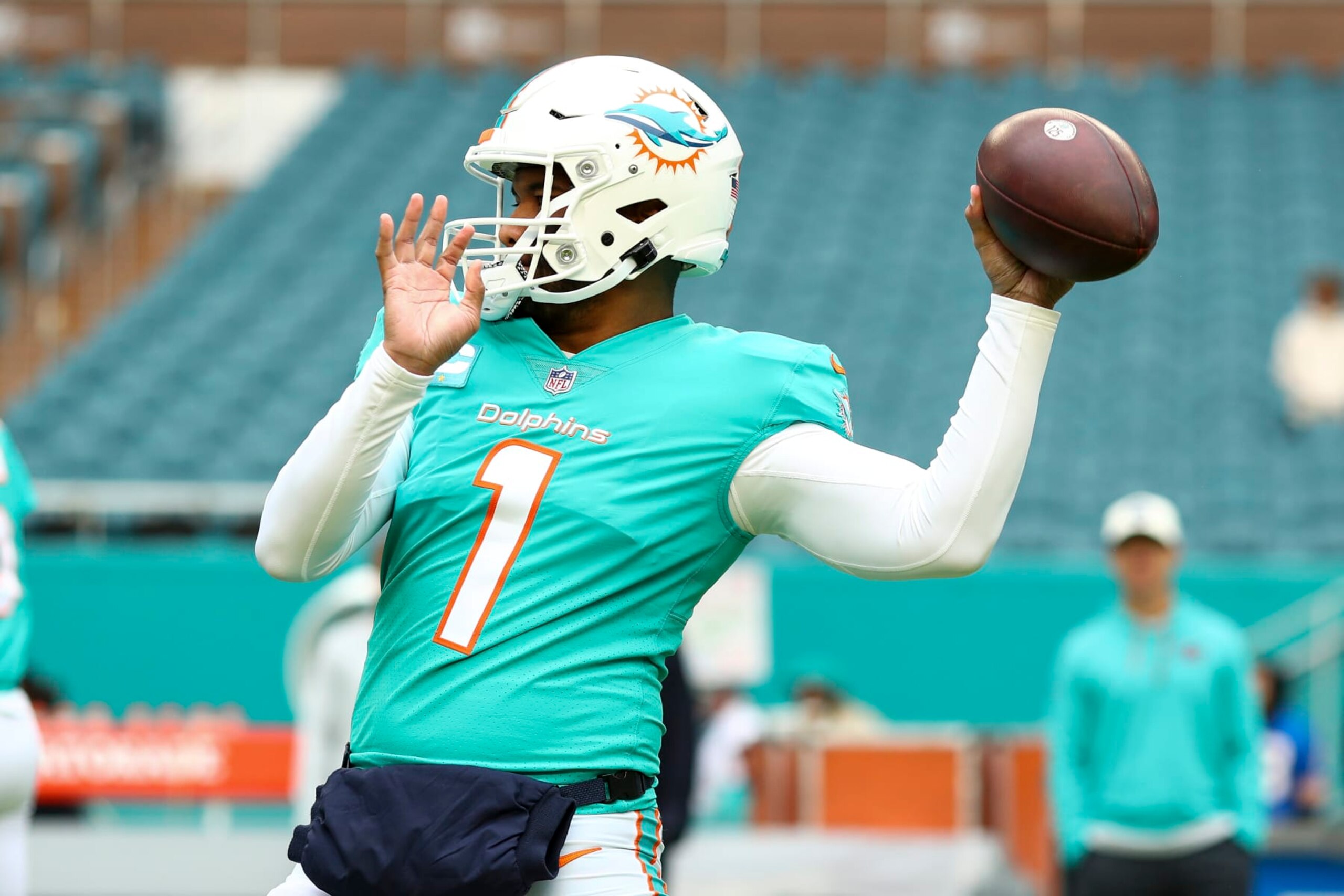 MIAMI GARDENS, FL - DECEMBER 25: Tua Tagovailoa #1 of the Miami Dolphins warms up prior to an NFL football game against the Green Bay Packers at Hard Rock Stadium on December 25, 2022 in Miami Gardens, Florida. (Photo by Kevin Sabitus/Getty Images)