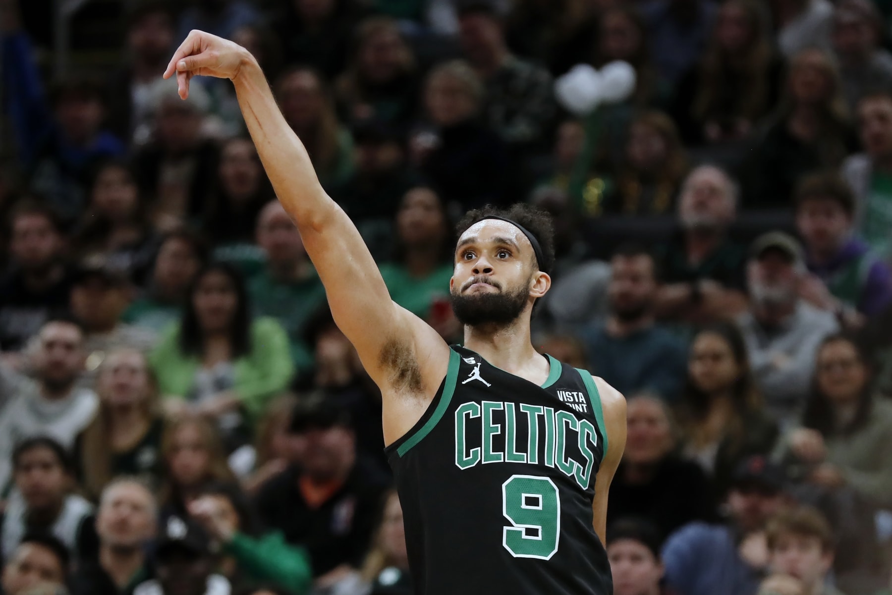 Boston Celtics' Derrick White watches his 3-pointer during the first half of an NBA basketball game against the Charlotte Hornets, Friday, Feb. 10, 2023, in Boston. (AP Photo/Michael Dwyer)