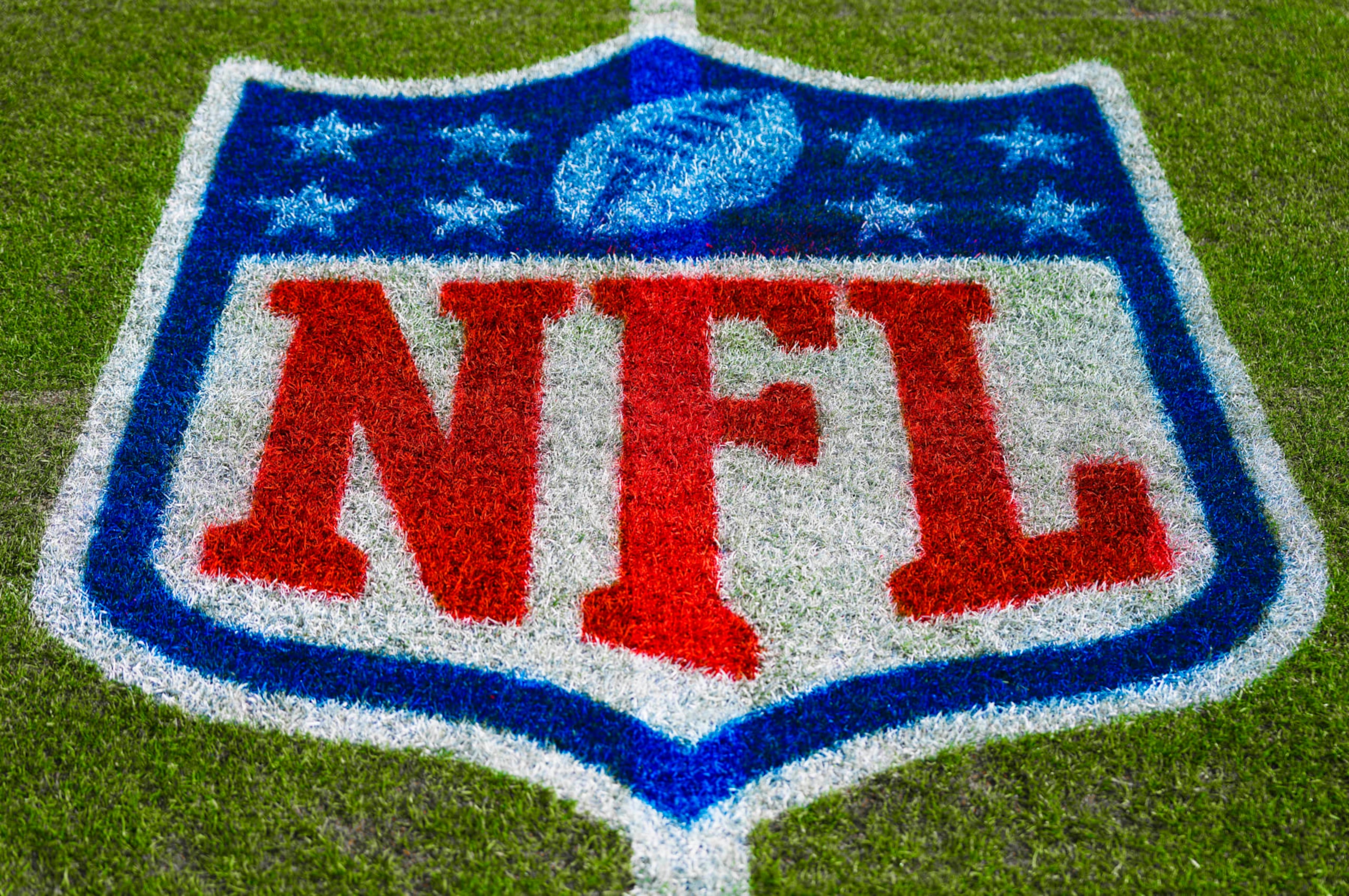 The NFL logo is shown painted on the field before an NFL football game between the Denver Broncos and the Los Angeles Chargers, Sunday, Jan. 8, 2023, in Denver. (AP Photo/Jack Dempsey) The NFL logo is shown painted on the field before an NFL football game between the Denver Broncos and the Los Angeles Chargers, Sunday, Jan. 8, 2023, in Denver. (AP Photo/Jack Dempsey)