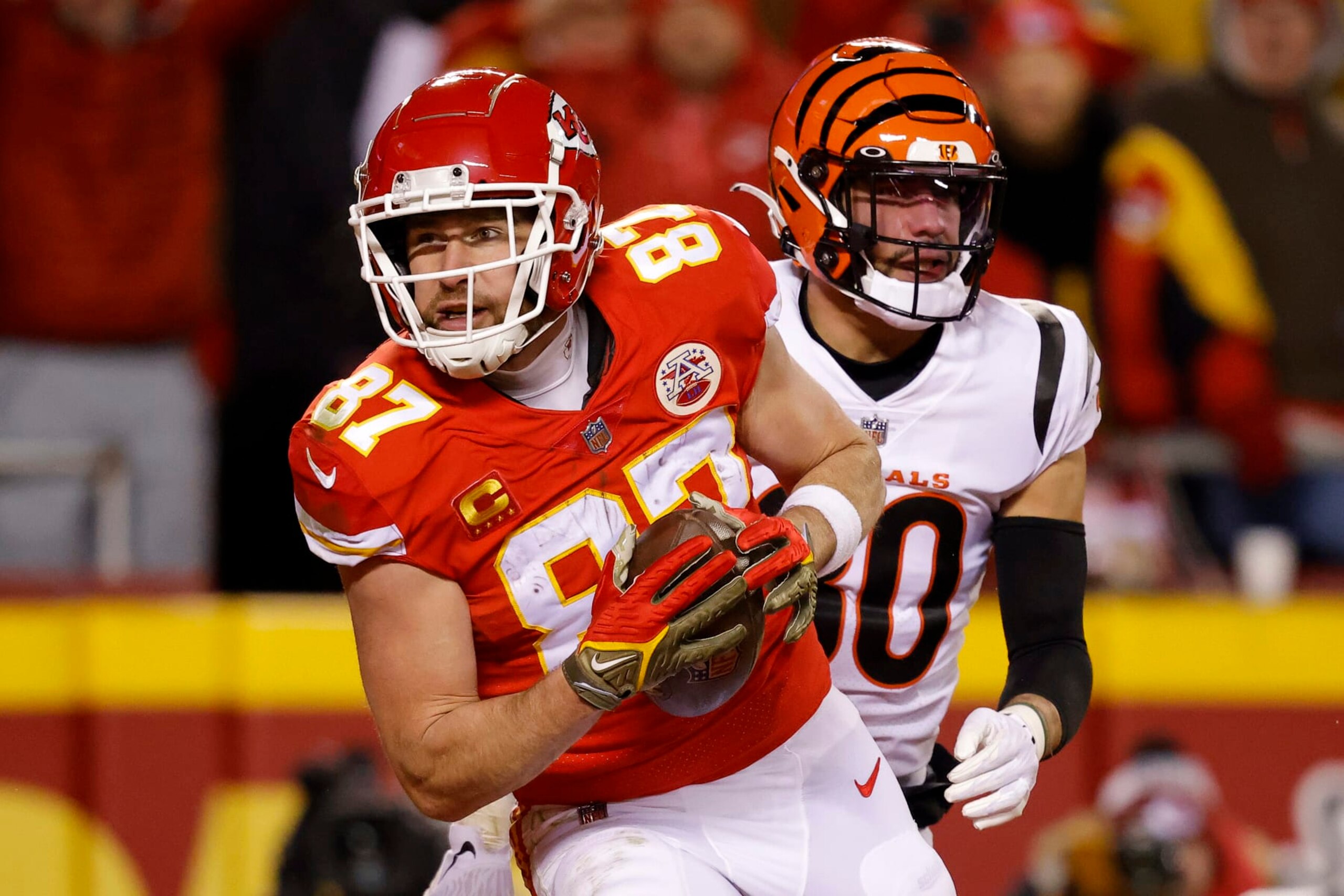 KANSAS CITY, MISSOURI - JANUARY 29: Travis Kelce #87 of the Kansas City Chiefs catches a pass for a touchdown against the Cincinnati Bengals during the second quarter in the AFC Championship Game at GEHA Field at Arrowhead Stadium on January 29, 2023 in Kansas City, Missouri. (Photo by David Eulitt/Getty Images)