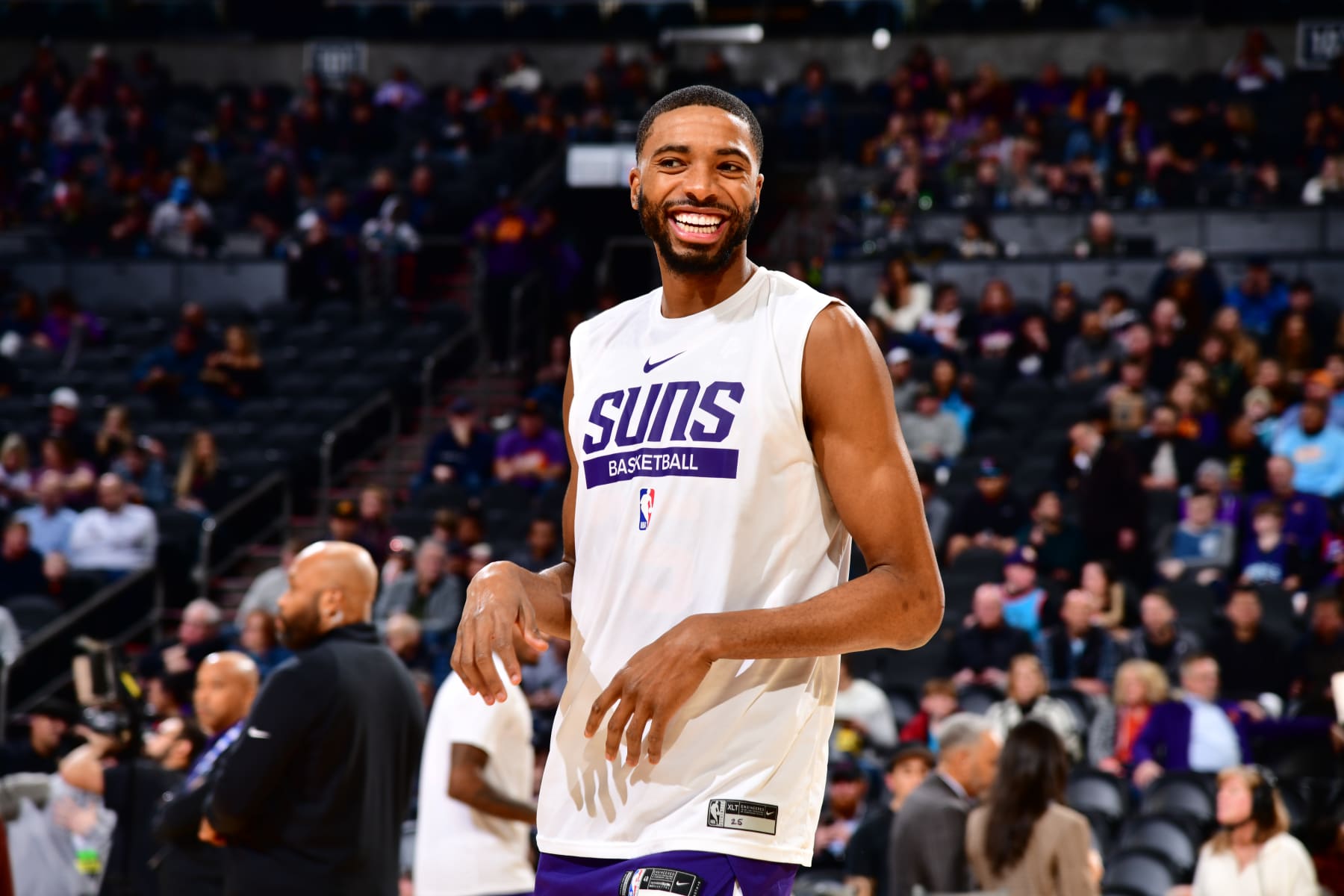 PHOENIX, AZ - JANUARY 24: Mikal Bridges #25 of the Phoenix Suns smiles before the game against the Charlotte Hornets on January 24, 2023 at Footprint Center in Phoenix, Arizona. NOTE TO USER: User expressly acknowledges and agrees that, by downloading and or using this photograph, user is consenting to the terms and conditions of the Getty Images License Agreement. Mandatory Copyright Notice: Copyright 2023 NBAE (Photo by Barry Gossage/NBAE via Getty Images)