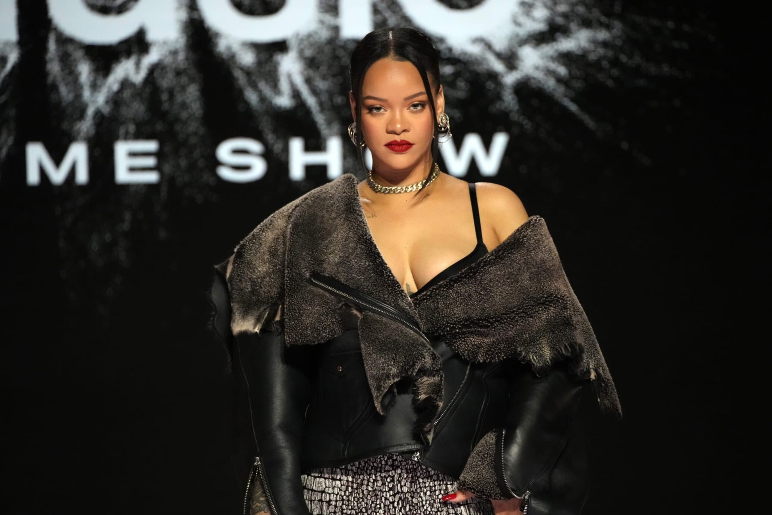 PHOENIX, ARIZONA - FEBRUARY 09: Rihanna speaks onstage during the press conference for Apple Music Super Bowl LVII Halftime Show at Phoenix Convention Center on February 09, 2023 in Phoenix, Arizona. (Photo by Jeff Kravitz/FilmMagic)