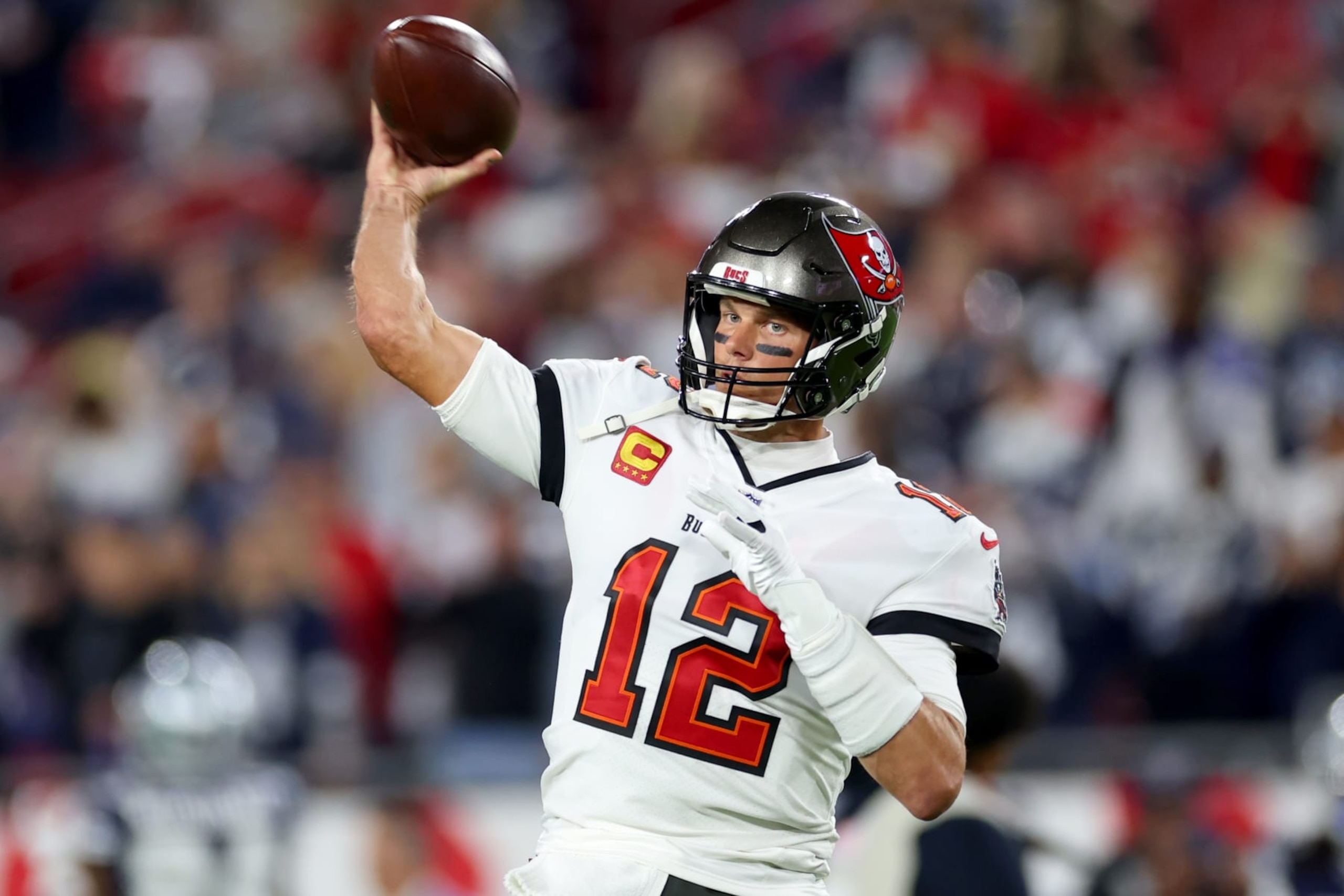 TAMPA, FLORIDA - JANUARY 16: Tom Brady #12 of the Tampa Bay Buccaneers warms up prior to a game against the Dallas Cowboys in the NFC Wild Card playoff game at Raymond James Stadium on January 16, 2023 in Tampa, Florida. (Photo by Mike Ehrmann/Getty Images)