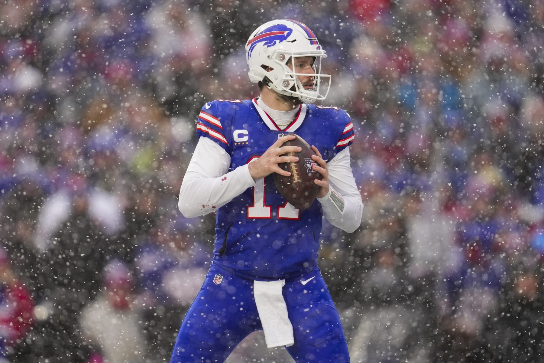 ORCHARD PARK, NY - JANUARY 22: Josh Allen #17 of the Buffalo Bills drops back against the Cincinnati Bengals at Highmark Stadium on January 22, 2023 in Orchard Park, New York. (Photo by Cooper Neill/Getty Images)