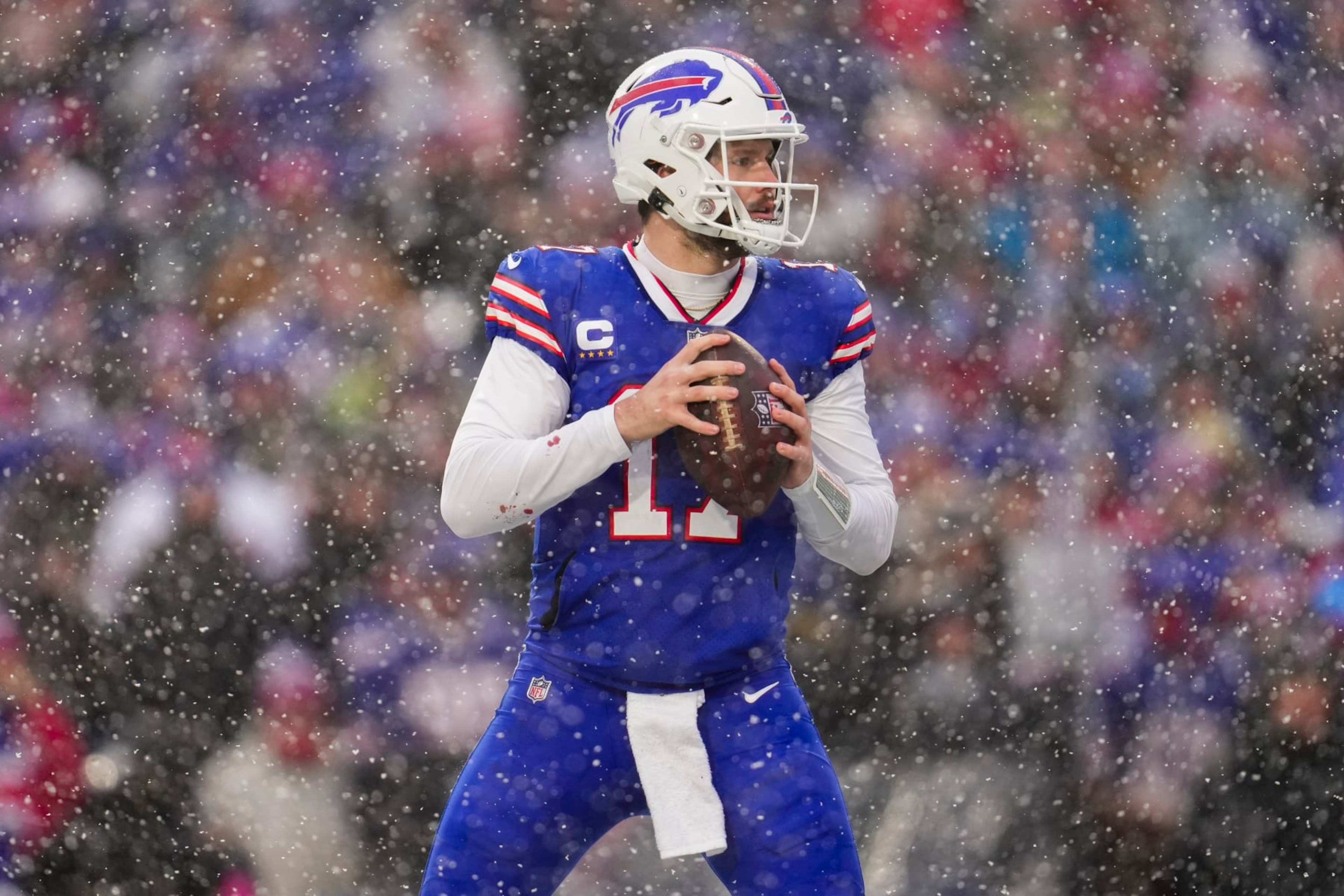 ORCHARD PARK, NY - JANUARY 22: Josh Allen #17 of the Buffalo Bills drops back against the Cincinnati Bengals at Highmark Stadium on January 22, 2023 in Orchard Park, New York. (Photo by Cooper Neill/Getty Images) ORCHARD PARK, NY - JANUARY 22: Josh Allen #17 of the Buffalo Bills drops back against the Cincinnati Bengals at Highmark Stadium on January 22, 2023 in Orchard Park, New York. (Photo by Cooper Neill/Getty Images)