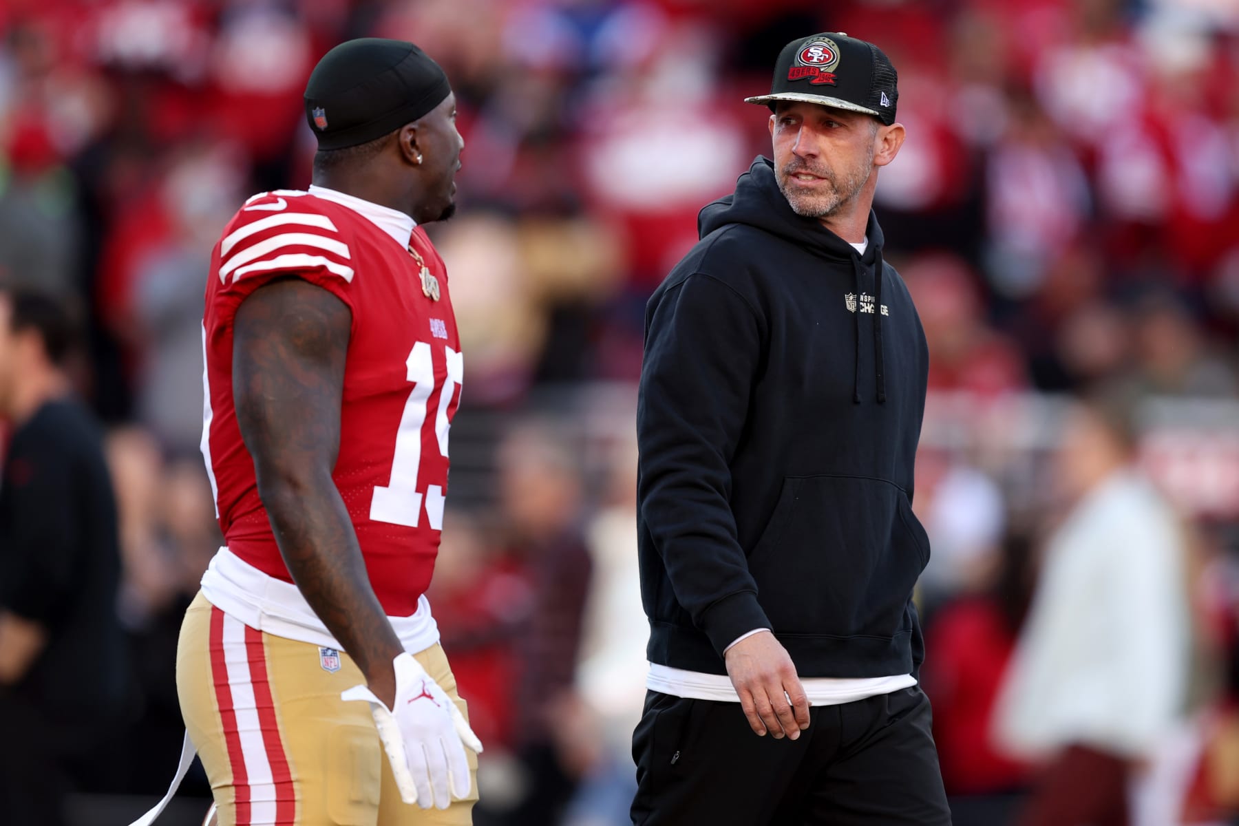 SANTA CLARA, CALIFORNIA - JANUARY 22: Deebo Samuel #19 and head coach Kyle Shanahan of the San Francisco 49ers talk on the field prior to a game against the Dallas Cowboys in the NFC Divisional Playoff game at Levi's Stadium on January 22, 2023 in Santa Clara, California. (Photo by Lachlan Cunningham/Getty Images)