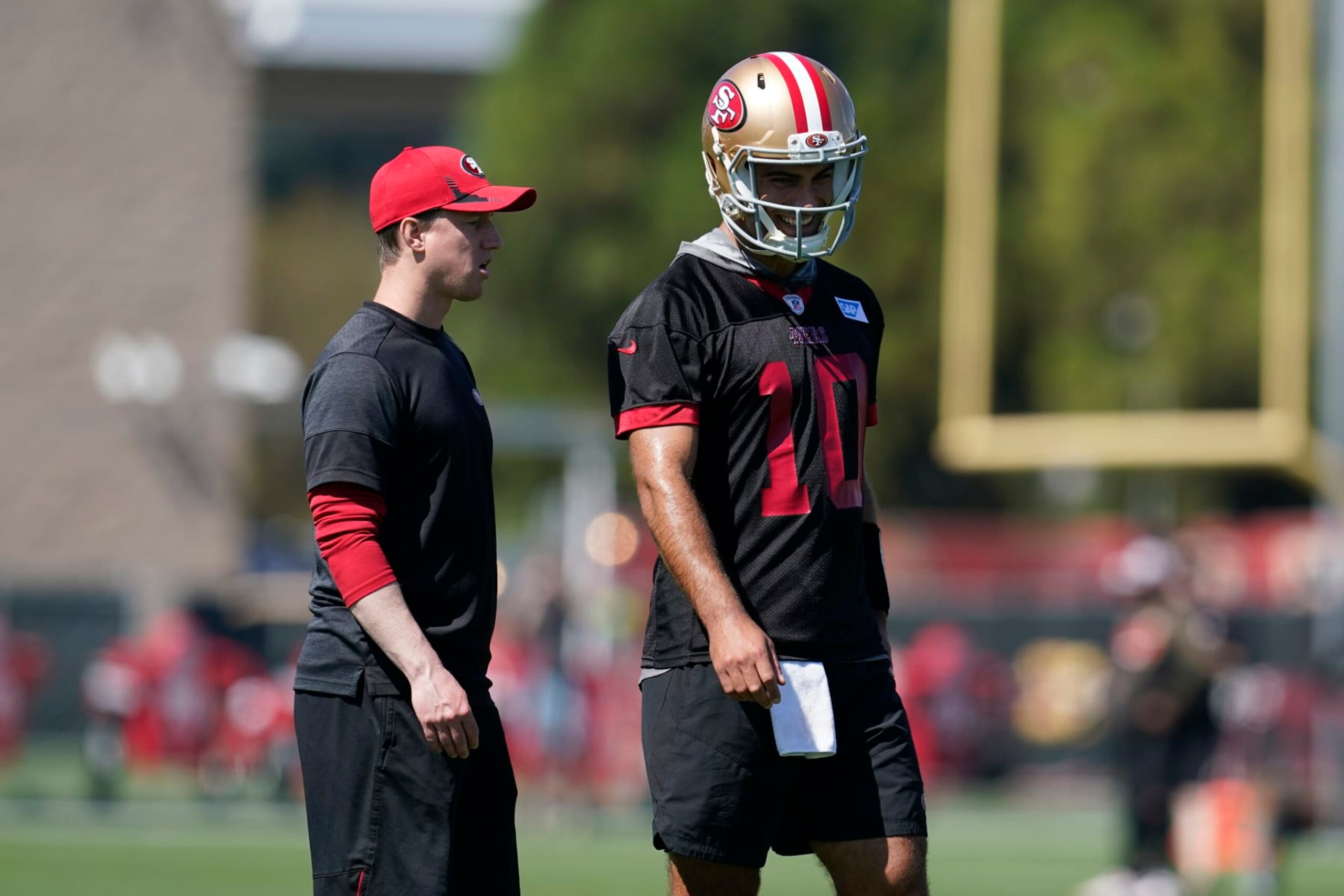 San Francisco 49ers' Jimmy Garoppolo, right, and offensive passing game coordinator Bobby Slowik take part in drills at the NFL football team's practice facility in Santa Clara, Calif., Thursday, Sept. 1, 2022. (AP Photo/Jeff Chiu) San Francisco 49ers' Jimmy Garoppolo, right, and offensive passing game coordinator Bobby Slowik take part in drills at the NFL football team's practice facility in Santa Clara, Calif., Thursday, Sept. 1, 2022. (AP Photo/Jeff Chiu)