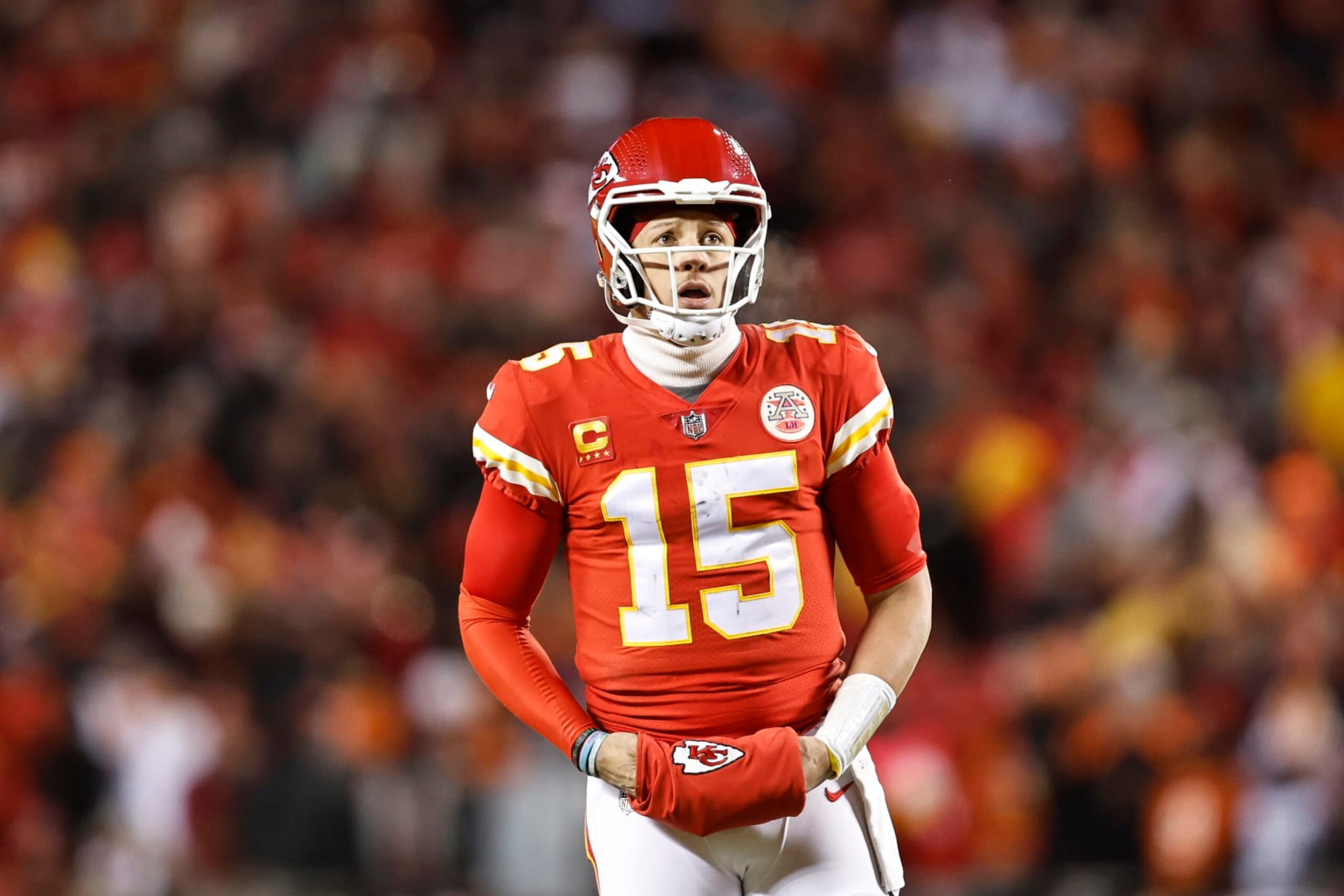 KANSAS CITY, MISSOURI - JANUARY 29: Patrick Mahomes #15 of the Kansas City Chiefs reacts as he looks on during the AFC Championship NFL football game between the Kansas City Chiefs and the Cincinnati Bengals at GEHA Field at Arrowhead Stadium on January 29, 2023 in Kansas City, Missouri. (Photo by Michael Owens/Getty Images)