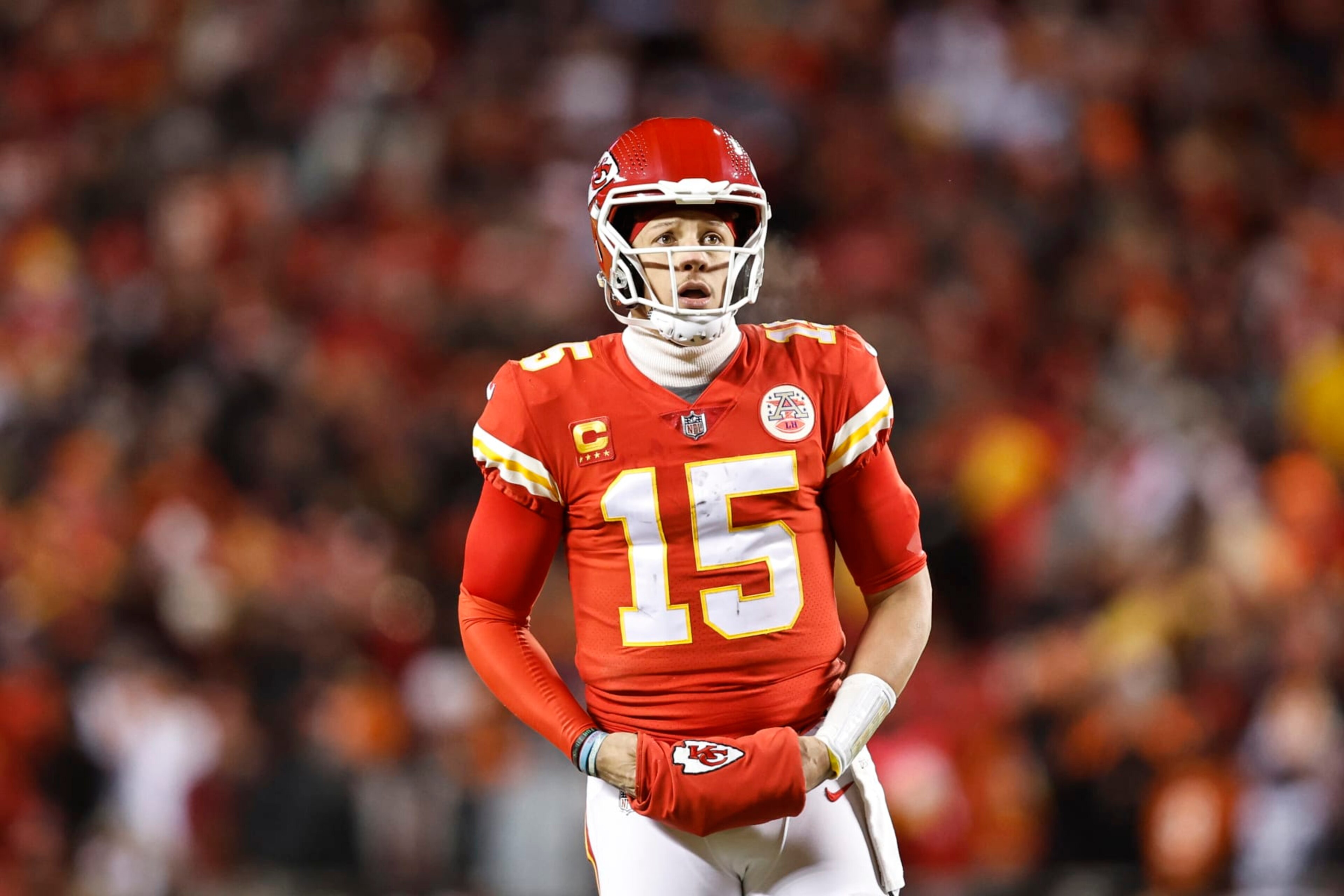 KANSAS CITY, MISSOURI - JANUARY 29: Patrick Mahomes #15 of the Kansas City Chiefs reacts as he looks on during the AFC Championship NFL football game between the Kansas City Chiefs and the Cincinnati Bengals at GEHA Field at Arrowhead Stadium on January 29, 2023 in Kansas City, Missouri. (Photo by Michael Owens/Getty Images)