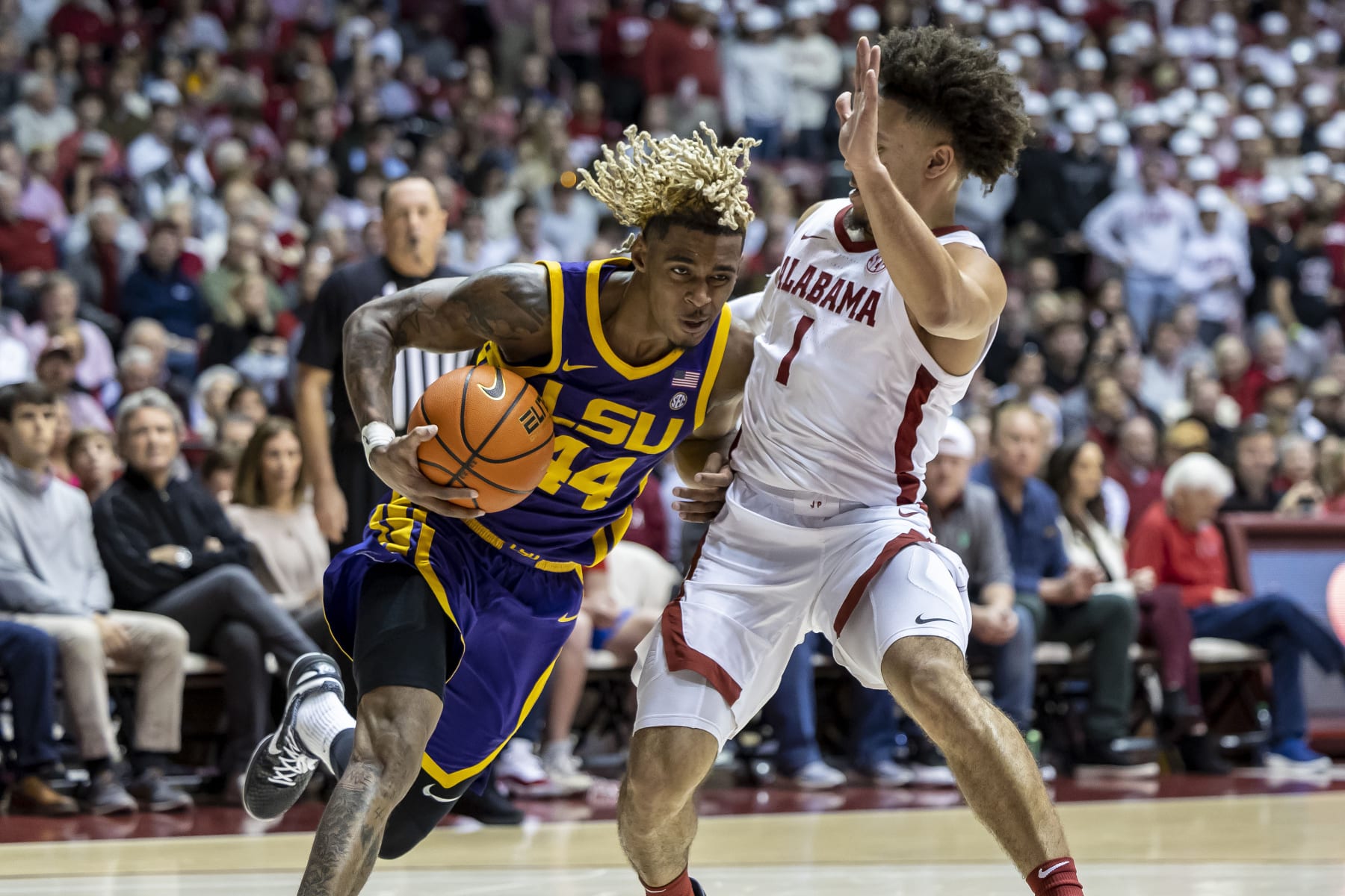 LSU guard Adam Miller (44) works inside against Alabama guard Mark Sears (1) during the first half of an NCAA college basketball game, Saturday, Jan. 14, 2023, in Tuscaloosa, Ala. (AP Photo/Vasha Hunt)