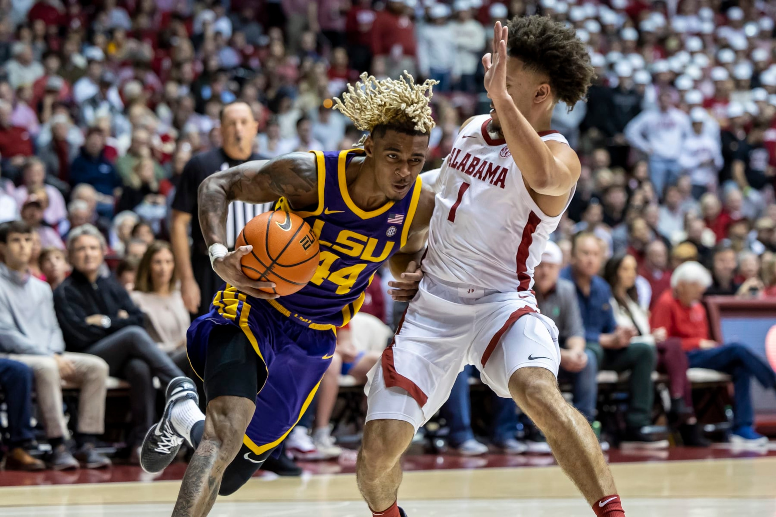 LSU guard Adam Miller (44) works inside against Alabama guard Mark Sears (1) during the first half of an NCAA college basketball game, Saturday, Jan. 14, 2023, in Tuscaloosa, Ala. (AP Photo/Vasha Hunt)