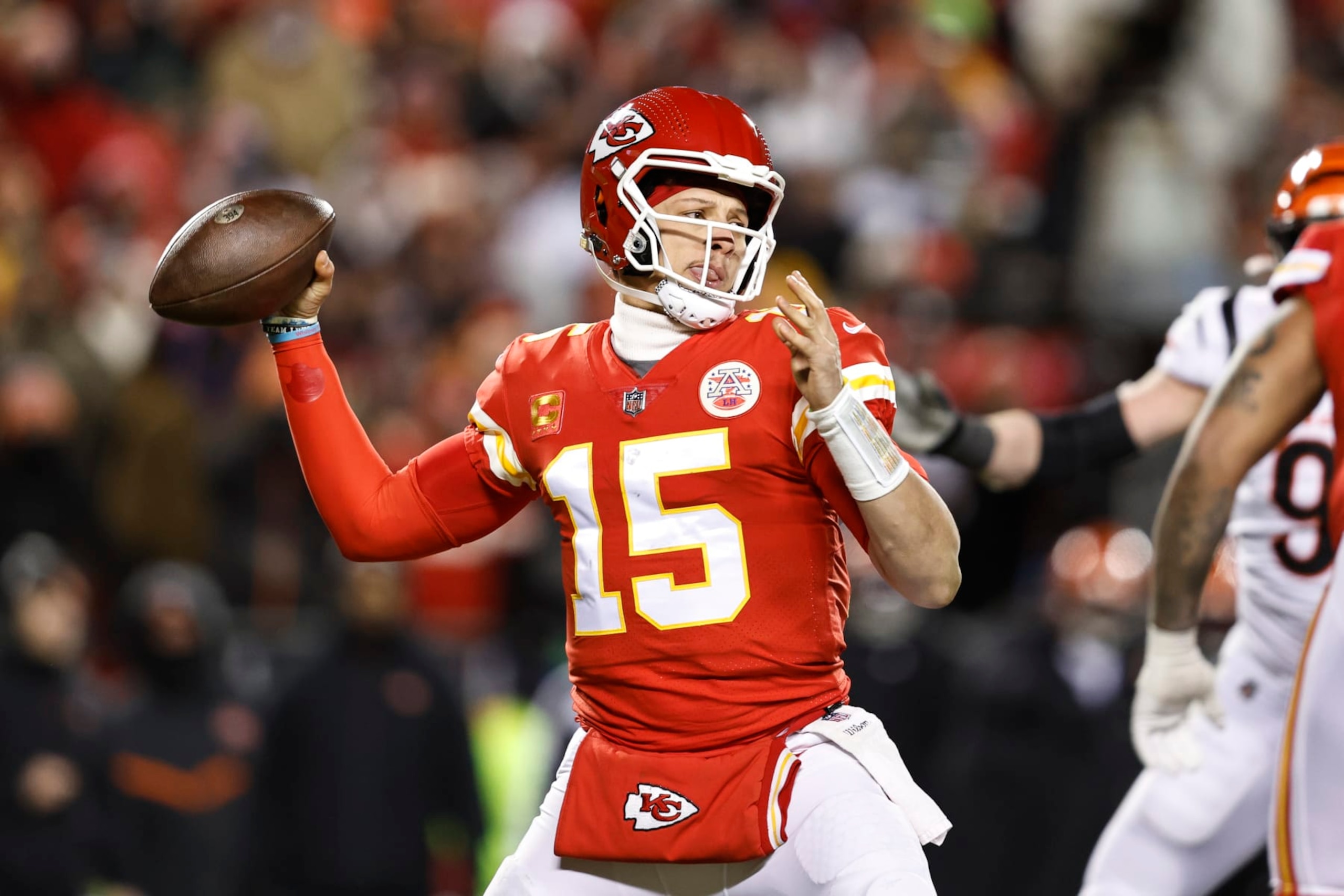 KANSAS CITY, MISSOURI - JANUARY 29: Patrick Mahomes #15 of the Kansas City Chiefs passes the ball during the AFC Championship NFL football game between the Kansas City Chiefs and the Cincinnati Bengals at GEHA Field at Arrowhead Stadium on January 29, 2023 in Kansas City, Missouri. (Photo by Michael Owens/Getty Images)