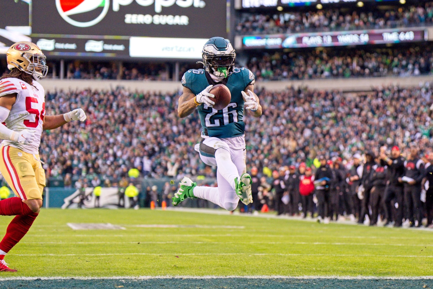 PHILADELPHIA, PA - JANUARY 29: Philadelphia Eagles running back Miles Sanders (26) scores a touchdown during the Championship game between the San Fransisco 49ers and the Philadelphia Eagles on January 29, 2023. (Photo by Andy Lewis/Icon Sportswire via Getty Images)