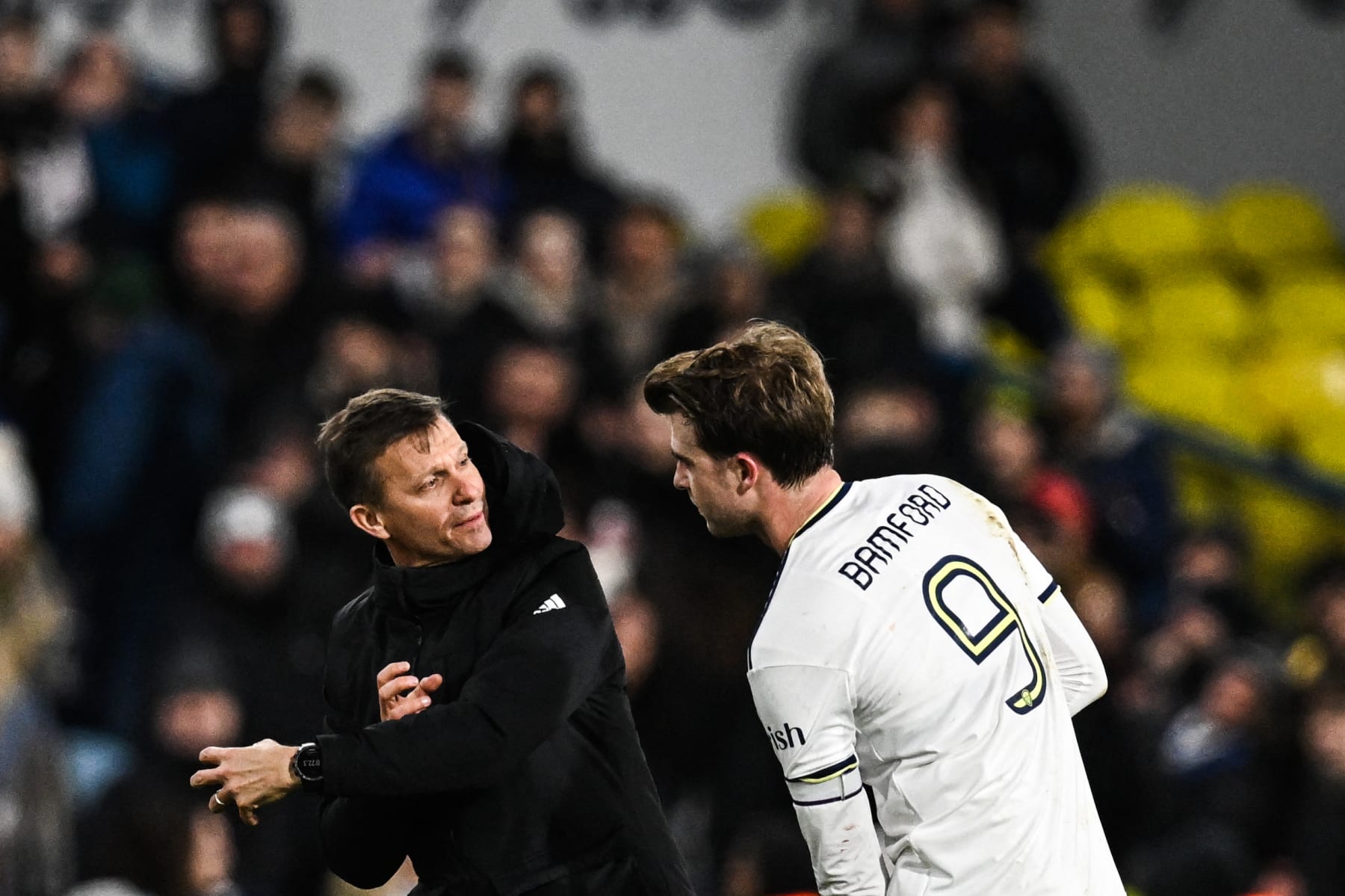 Leeds United's US head coach Jesse Marsch (L) speaks with Leeds United's English striker Patrick Bamford at the end of the English FA Cup third round football match between Leeds United and  Cardiff City at Elland Road in Leeds, northern England on January 18, 2023. - Leeds wins 5 - 2 against Cardiff. - RESTRICTED TO EDITORIAL USE. No use with unauthorized audio, video, data, fixture lists, club/league logos or 'live' services. Online in-match use limited to 120 images. An additional 40 images may be used in extra time. No video emulation. Social media in-match use limited to 120 images. An additional 40 images may be used in extra time. No use in betting publications, games or single club/league/player publications. (Photo by Paul ELLIS / AFP) / RESTRICTED TO EDITORIAL USE. No use with unauthorized audio, video, data, fixture lists, club/league logos or 'live' services. Online in-match use limited to 120 images. An additional 40 images may be used in extra time. No video emulation. Social media in-match use limited to 120 images. An additional 40 images may be used in extra time. No use in betting publications, games or single club/league/player publications. / RESTRICTED TO EDITORIAL USE. No use with unauthorized audio, video, data, fixture lists, club/league logos or 'live' services. Online in-match use limited to 120 images. An additional 40 images may be used in extra time. No video emulation. Social media in-match use limited to 120 images. An additional 40 images may be used in extra time. No use in betting publications, games or single club/league/player publications. (Photo by PAUL ELLIS/AFP via Getty Images)