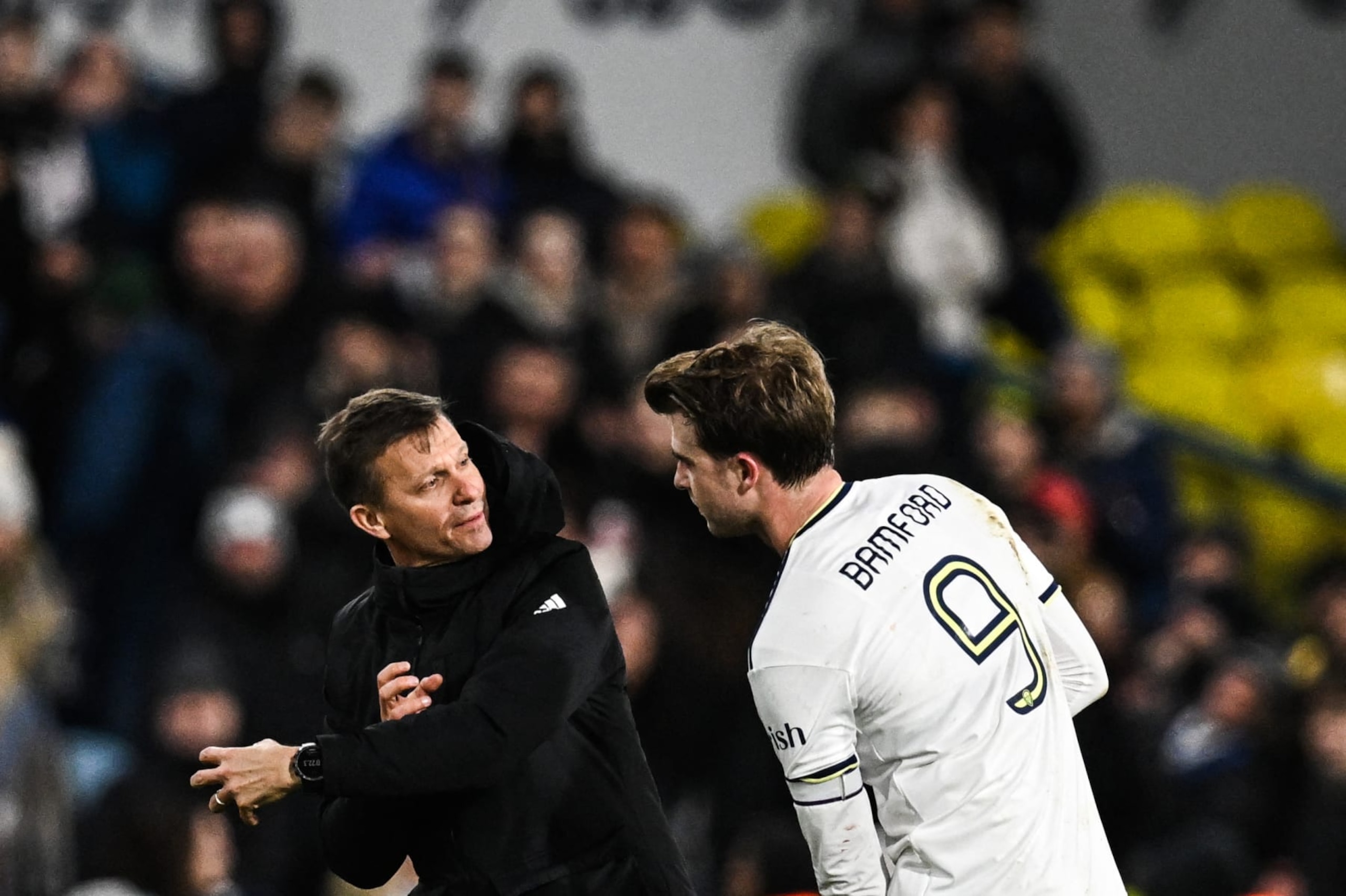 Leeds United's US head coach Jesse Marsch (L) speaks with Leeds United's English striker Patrick Bamford at the end of the English FA Cup third round football match between Leeds United and  Cardiff City at Elland Road in Leeds, northern England on January 18, 2023. - Leeds wins 5 - 2 against Cardiff. - RESTRICTED TO EDITORIAL USE. No use with unauthorized audio, video, data, fixture lists, club/league logos or 'live' services. Online in-match use limited to 120 images. An additional 40 images may be used in extra time. No video emulation. Social media in-match use limited to 120 images. An additional 40 images may be used in extra time. No use in betting publications, games or single club/league/player publications. (Photo by Paul ELLIS / AFP) / RESTRICTED TO EDITORIAL USE. No use with unauthorized audio, video, data, fixture lists, club/league logos or 'live' services. Online in-match use limited to 120 images. An additional 40 images may be used in extra time. No video emulation. Social media in-match use limited to 120 images. An additional 40 images may be used in extra time. No use in betting publications, games or single club/league/player publications. / RESTRICTED TO EDITORIAL USE. No use with unauthorized audio, video, data, fixture lists, club/league logos or 'live' services. Online in-match use limited to 120 images. An additional 40 images may be used in extra time. No video emulation. Social media in-match use limited to 120 images. An additional 40 images may be used in extra time. No use in betting publications, games or single club/league/player publications. (Photo by PAUL ELLIS/AFP via Getty Images)
