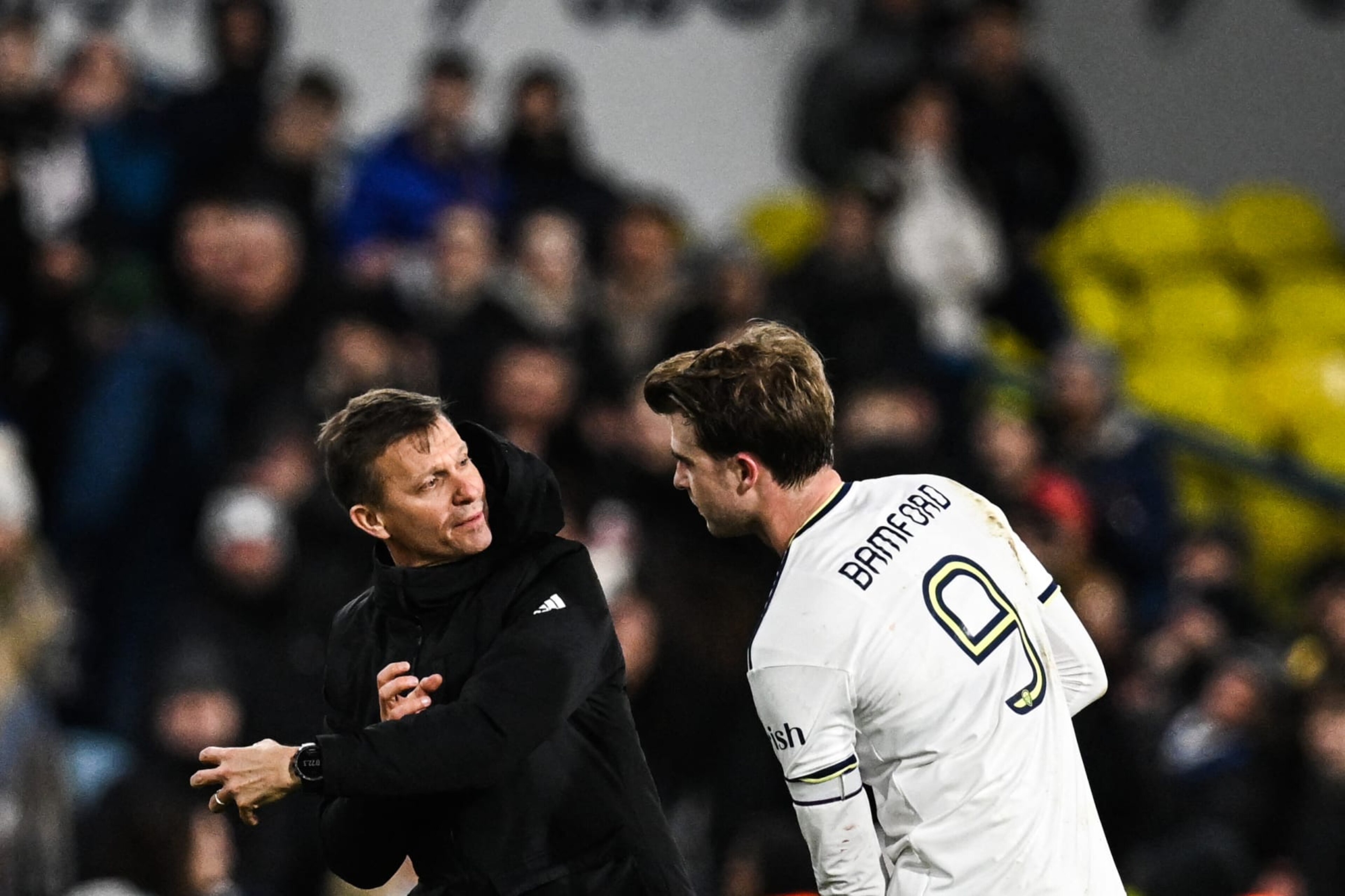 Leeds United's US head coach Jesse Marsch (L) speaks with Leeds United's English striker Patrick Bamford at the end of the English FA Cup third round football match between Leeds United and  Cardiff City at Elland Road in Leeds, northern England on January 18, 2023. - Leeds wins 5 - 2 against Cardiff. - RESTRICTED TO EDITORIAL USE. No use with unauthorized audio, video, data, fixture lists, club/league logos or 'live' services. Online in-match use limited to 120 images. An additional 40 images may be used in extra time. No video emulation. Social media in-match use limited to 120 images. An additional 40 images may be used in extra time. No use in betting publications, games or single club/league/player publications. (Photo by Paul ELLIS / AFP) / RESTRICTED TO EDITORIAL USE. No use with unauthorized audio, video, data, fixture lists, club/league logos or 'live' services. Online in-match use limited to 120 images. An additional 40 images may be used in extra time. No video emulation. Social media in-match use limited to 120 images. An additional 40 images may be used in extra time. No use in betting publications, games or single club/league/player publications. / RESTRICTED TO EDITORIAL USE. No use with unauthorized audio, video, data, fixture lists, club/league logos or 'live' services. Online in-match use limited to 120 images. An additional 40 images may be used in extra time. No video emulation. Social media in-match use limited to 120 images. An additional 40 images may be used in extra time. No use in betting publications, games or single club/league/player publications. (Photo by PAUL ELLIS/AFP via Getty Images)