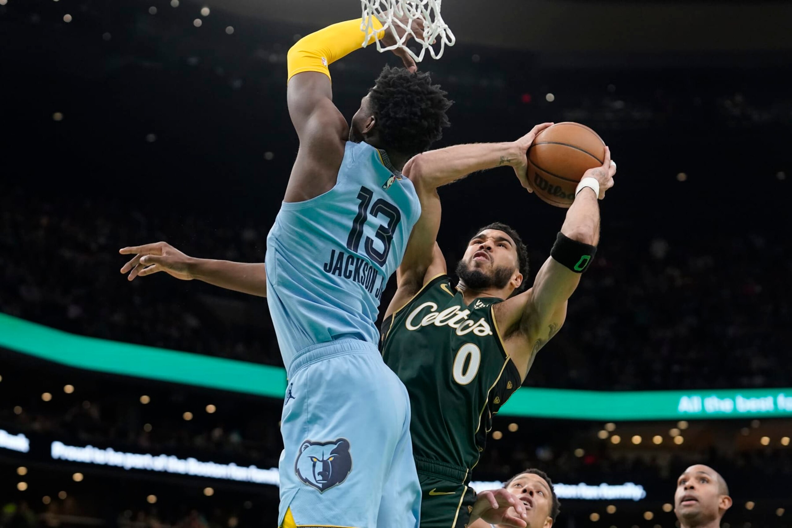 Memphis Grizzlies forward Jaren Jackson Jr. (13) defends as Boston Celtics forward Jayson Tatum (0) looks to shoot at the basket in the first half of an NBA basketball game, Sunday, Feb. 12, 2023, in Boston. (AP Photo/Steven Senne) Memphis Grizzlies forward Jaren Jackson Jr. (13) defends as Boston Celtics forward Jayson Tatum (0) looks to shoot at the basket in the first half of an NBA basketball game, Sunday, Feb. 12, 2023, in Boston. (AP Photo/Steven Senne)